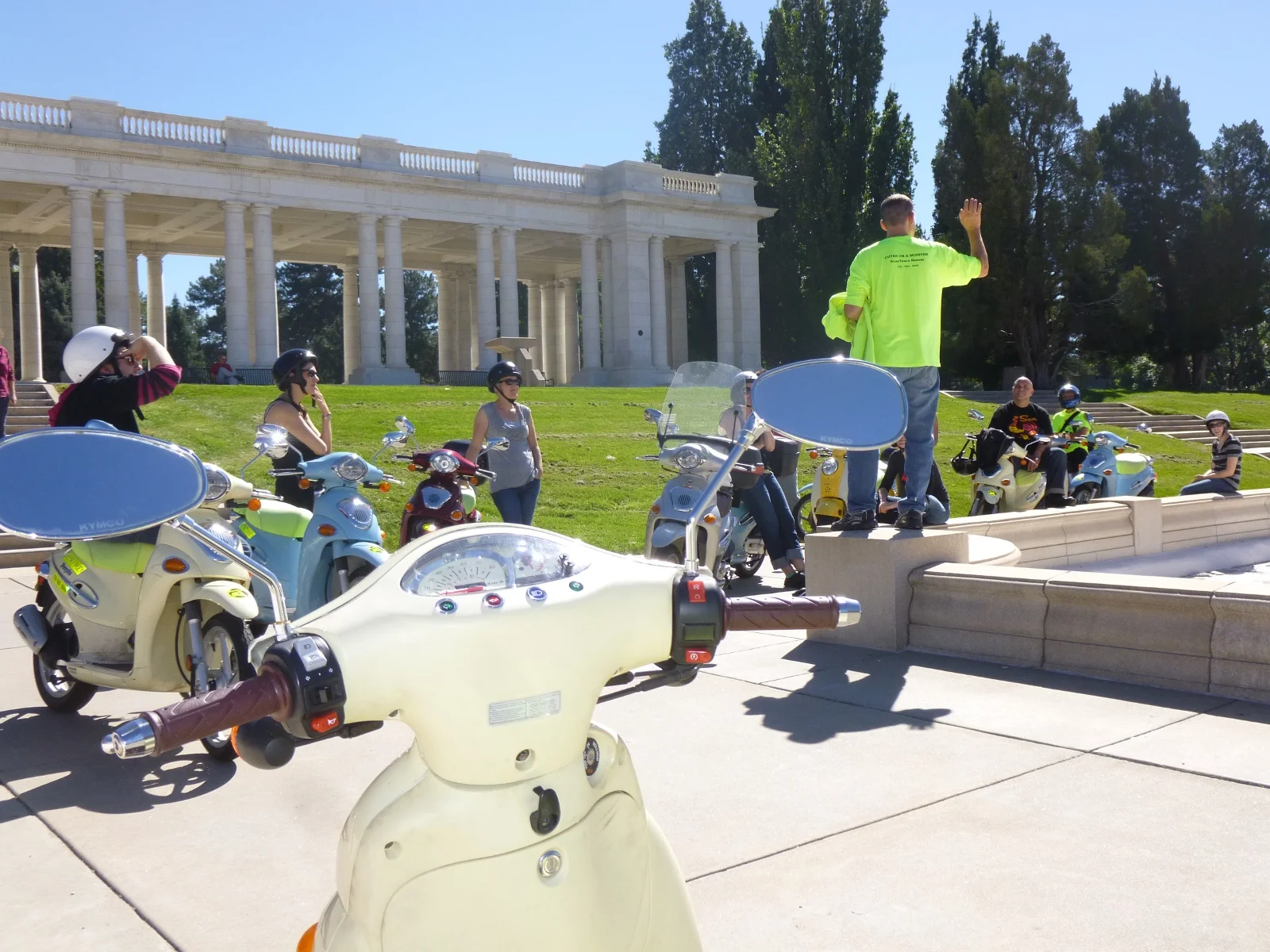 20130925 TenScootersTourStopCheesmanPavilionHandUpMediumSmall.JPG