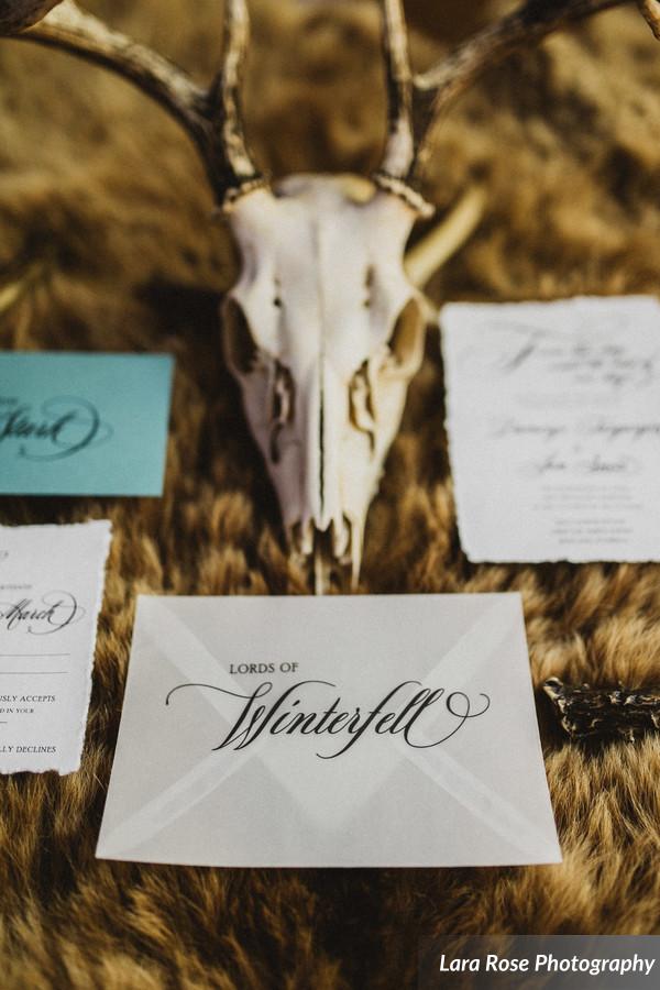 Rustic, hand torn edges wrapped with gray twine sealed with a wax seal. Game of Thrones Wedding invitation by Only One Mark