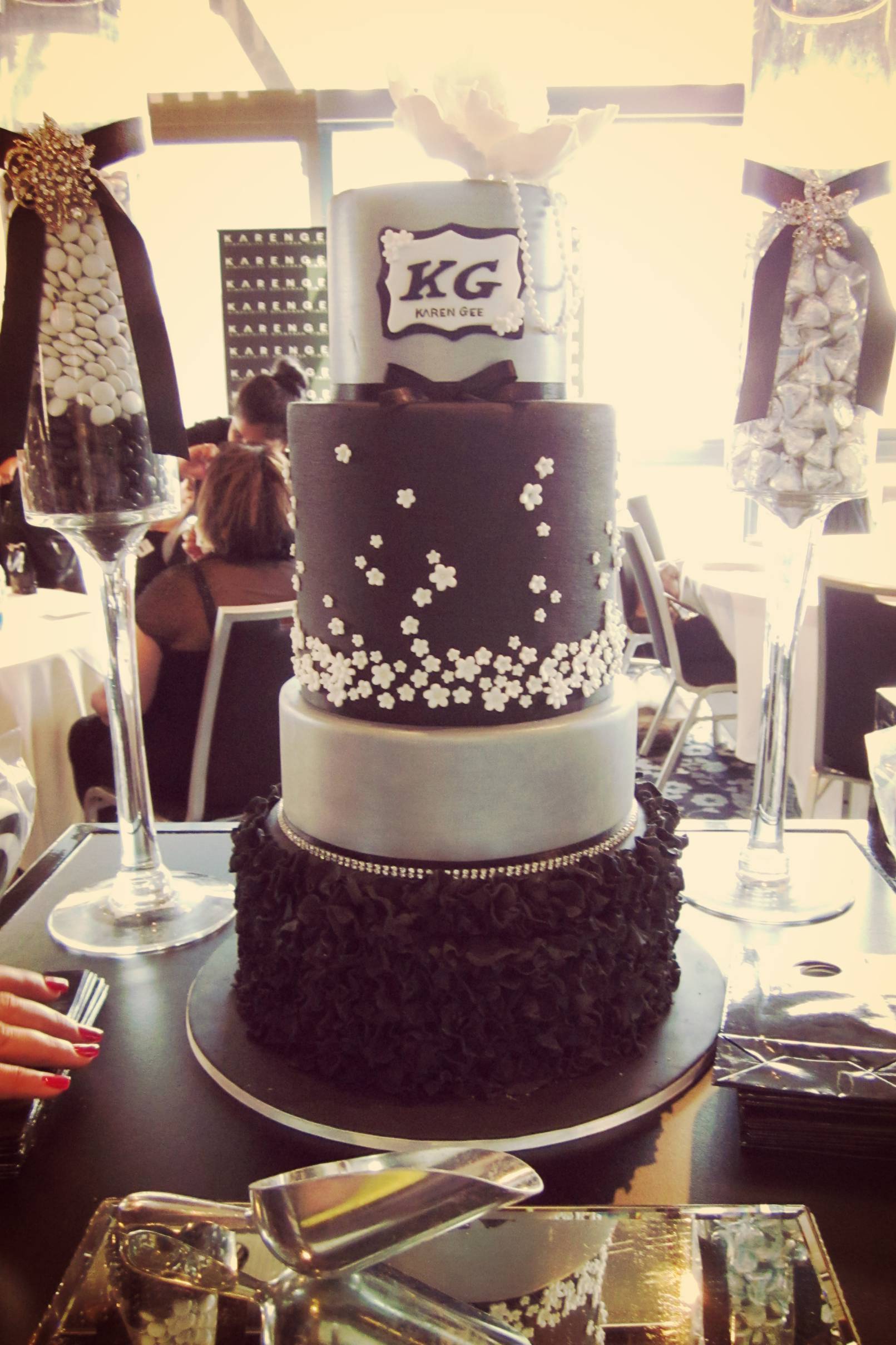 Four-tiered cake by Miss Shell's Cakes .
