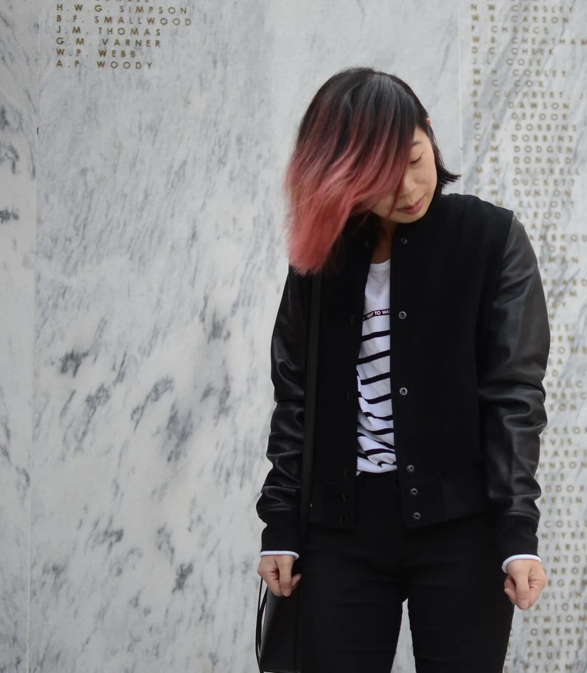 Ally Hwang standing in front of Veterans Memorial