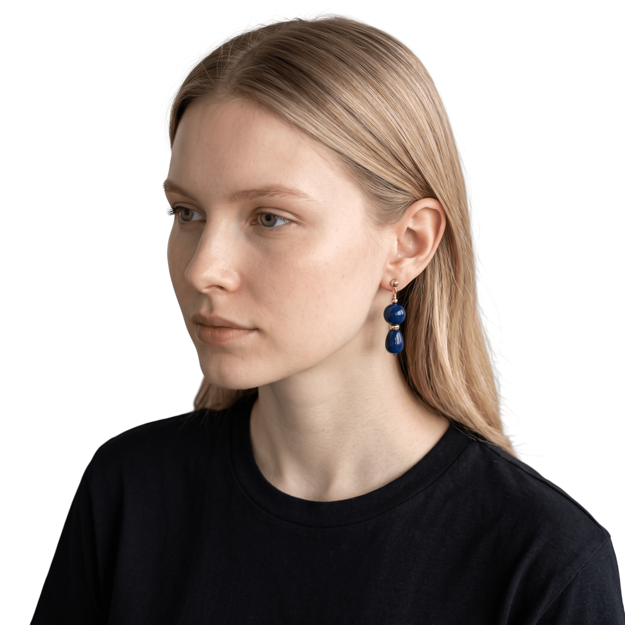 Close-up of a woman's face showing her hair, eye, and part of her ear with an earring, against a black background.