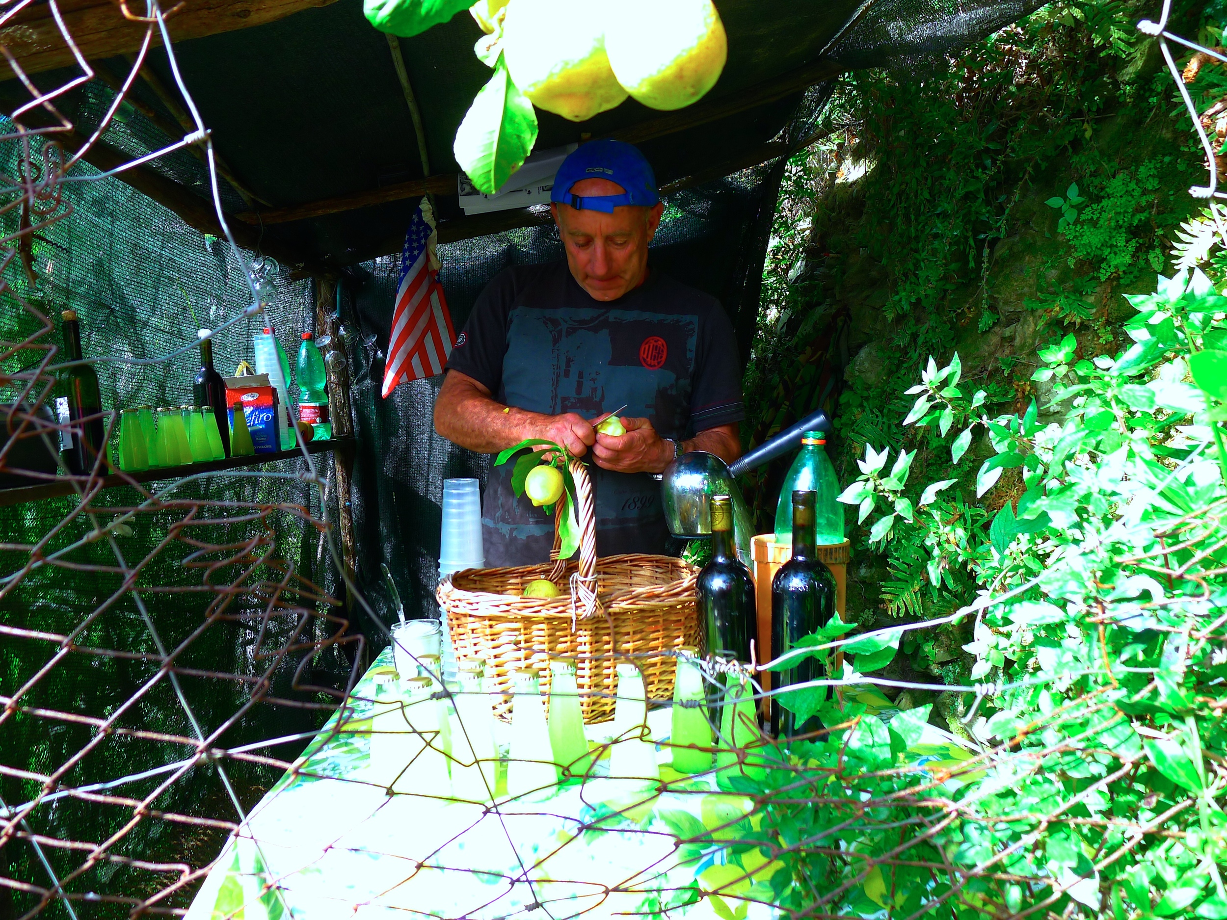 A man selling limoncello along the hiking trails in Cinque Terre, Italy. 