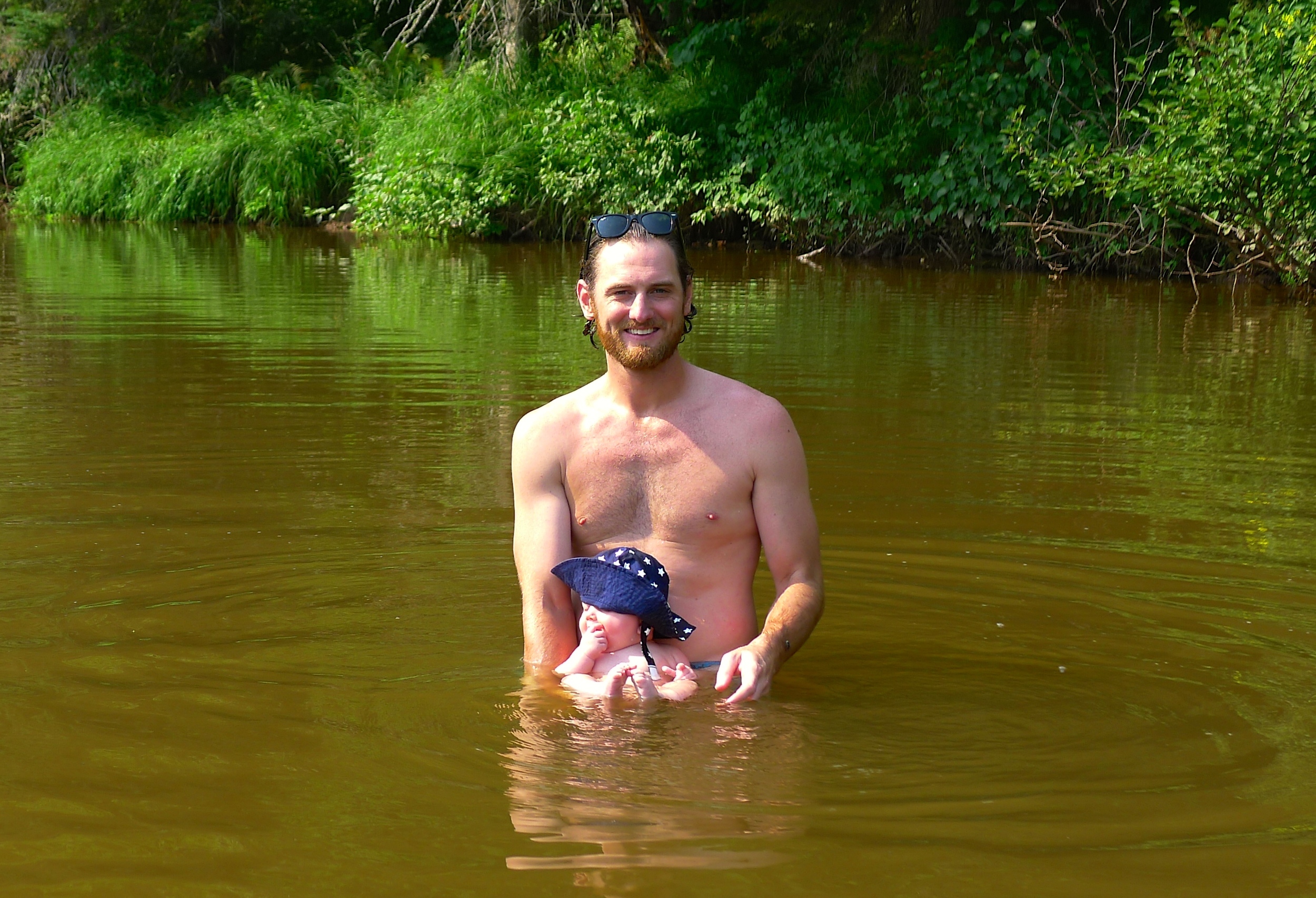  Jeff and Natalie taking a dip in the river in front of Whiskey Hollow Creek. Kid loves the outdoors.&nbsp; 