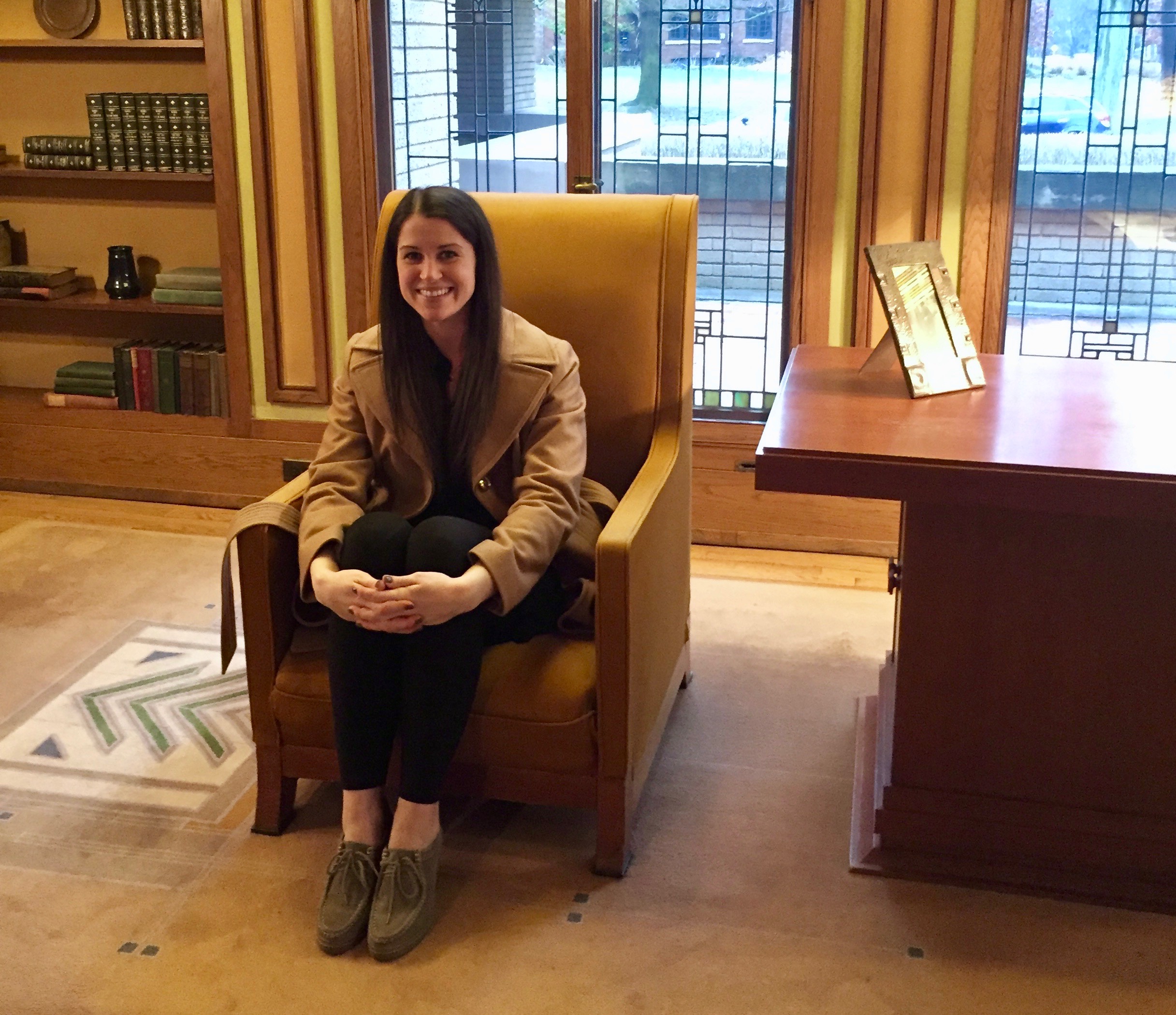 Inside the Meyer May House sitting on one of the designer chairs that's much too small for my height - the entire structure was made for a family closer to 5 feet. 