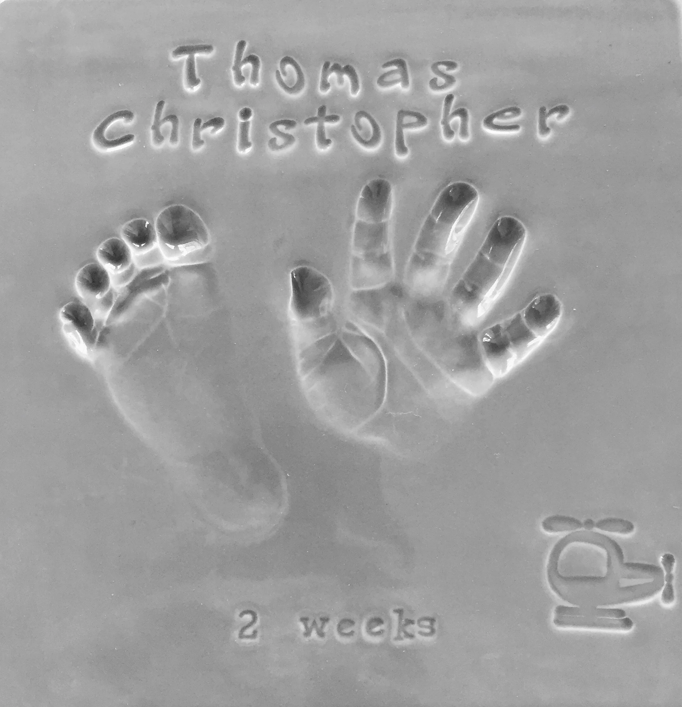 Thomas' Captured in Clay tile that will join the rest of his cousins and sister's tiles that hang in his grandparents house on the lake. 