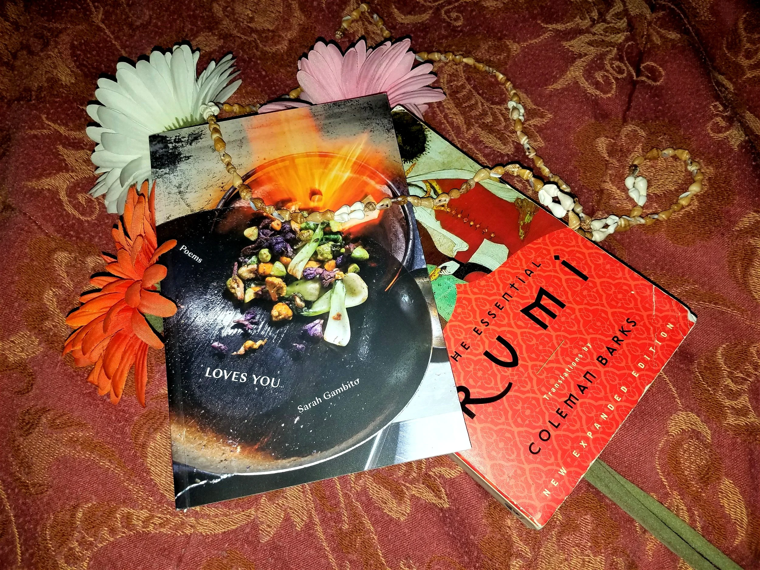 Sarah Gambito’s latest poetry collection, Loves You (Persea Books), with The Essential Rumi .