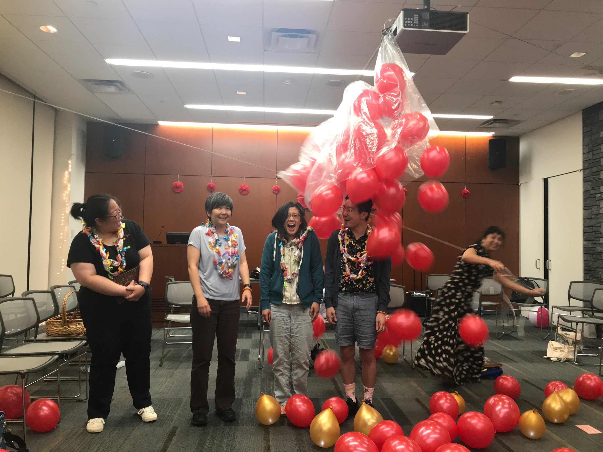 Graduating Fellows Diana Park, Heather Nagami, Jane Lin, and Chen Chen during the balloon drop!