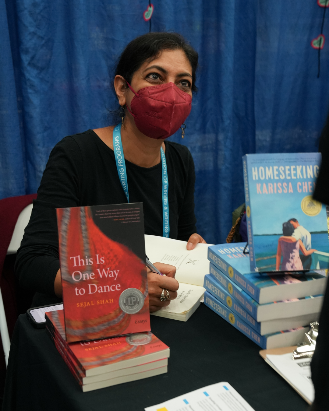 Sejal Shah signing her book at the Kundiman booth