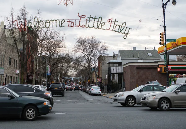 A welcome sign to the Bronx’s Little Italy neighborhood on Arthur Avenue, from East Fordham Road. CreditEmon Hassan for The New York Times