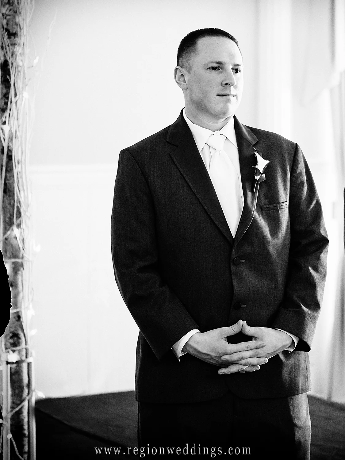 The groom reacts as he sees his bride for the first time.