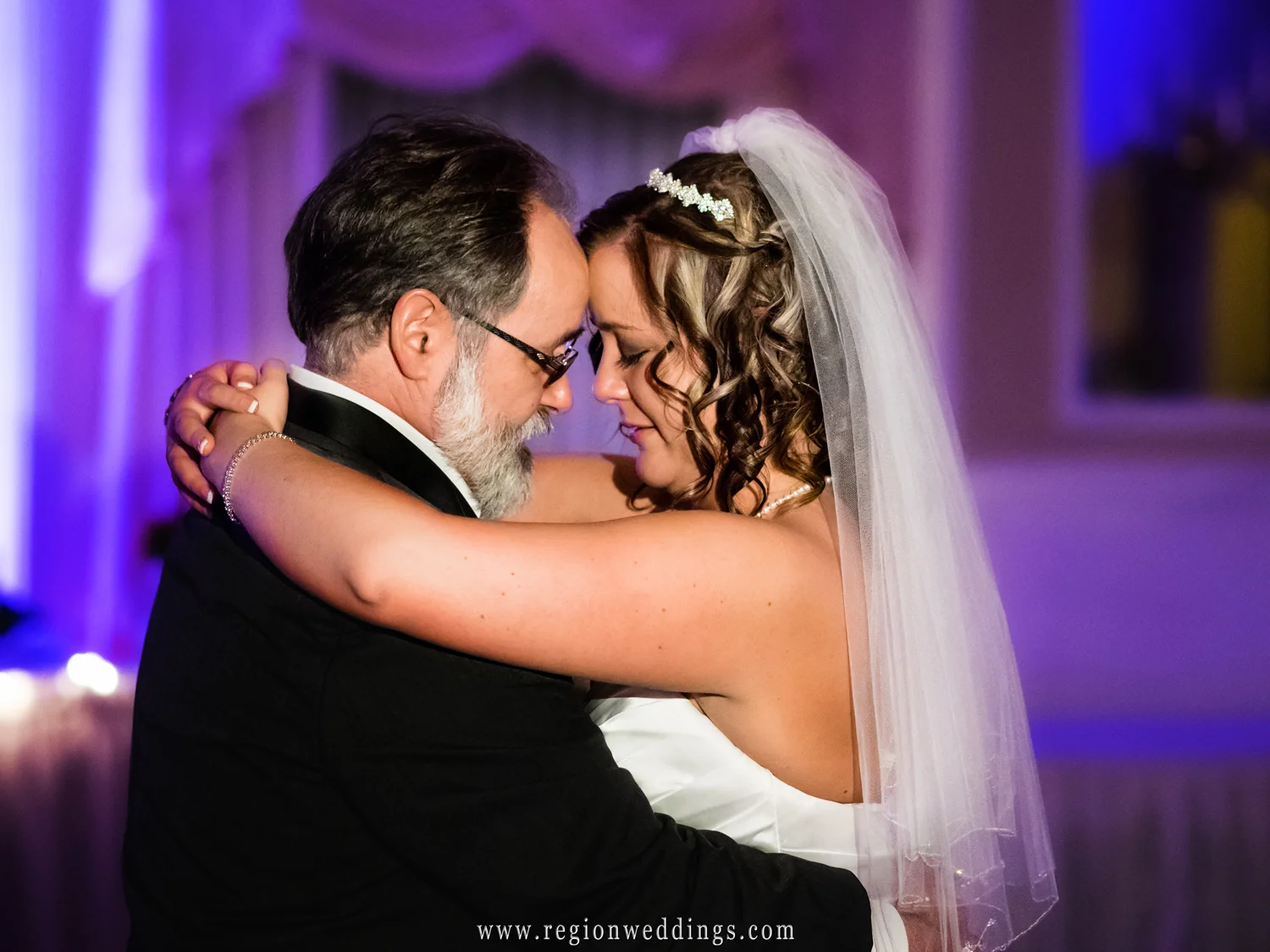 The bride tears up during the first dance with her Father.