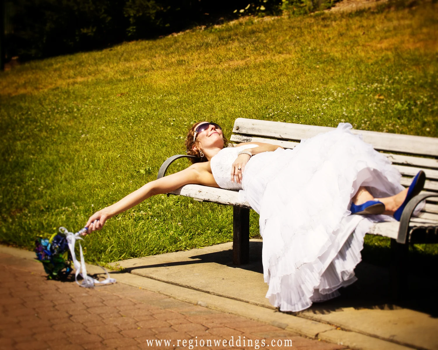 The bride takes a short nap during her wedding photo session in Hobart, Indiana.