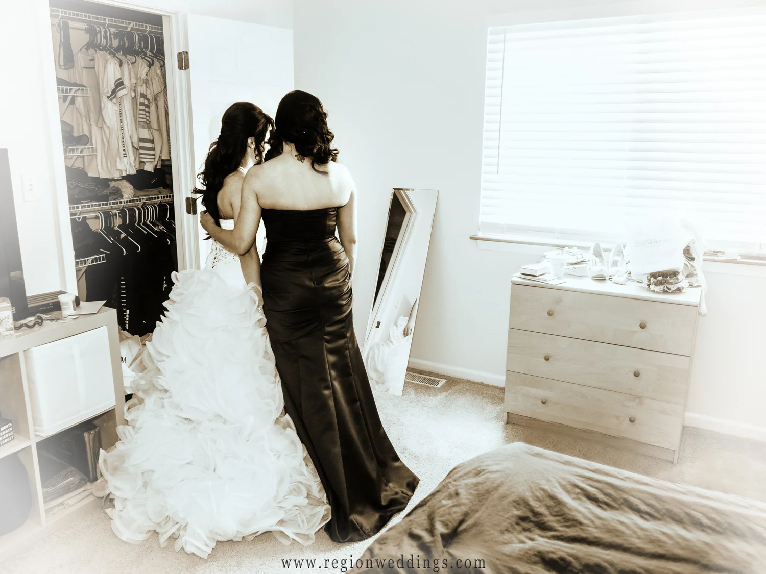 The bride alone with her mother before the ceremony.