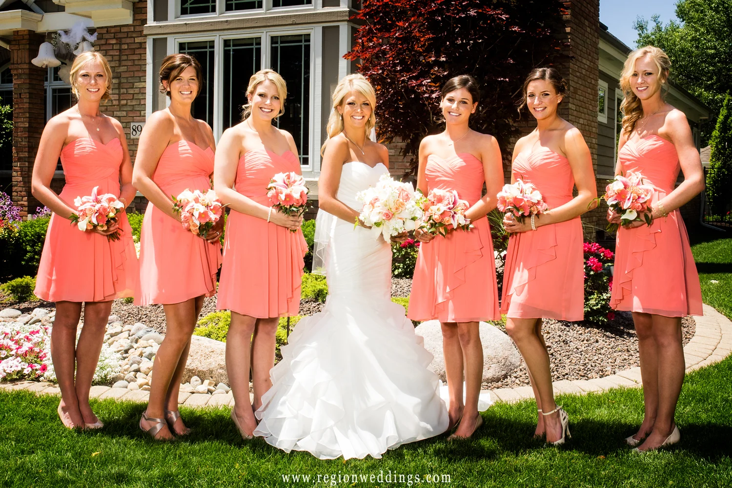 Cute picture of the bride and her girls in front of her parent's home.