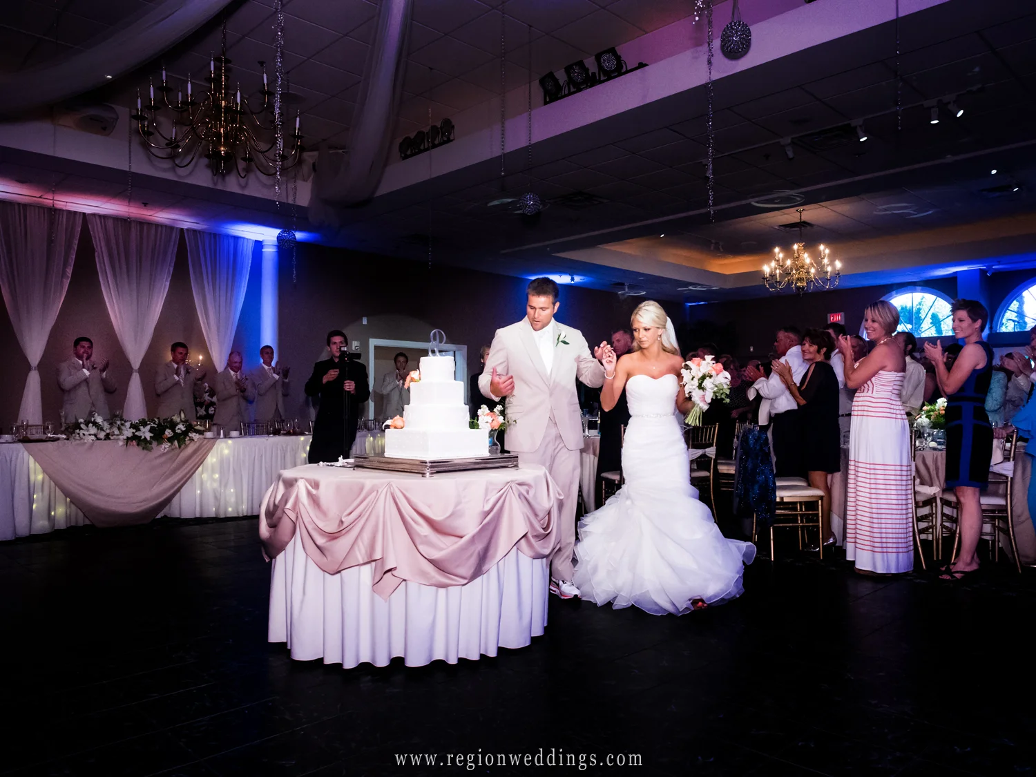 The bride and groom enter the Aberdeen ballroom for their wedding reception.