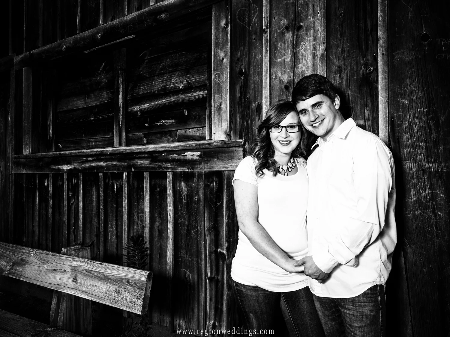 A young couple in front of the Sugar Shack at Deep River County Park.