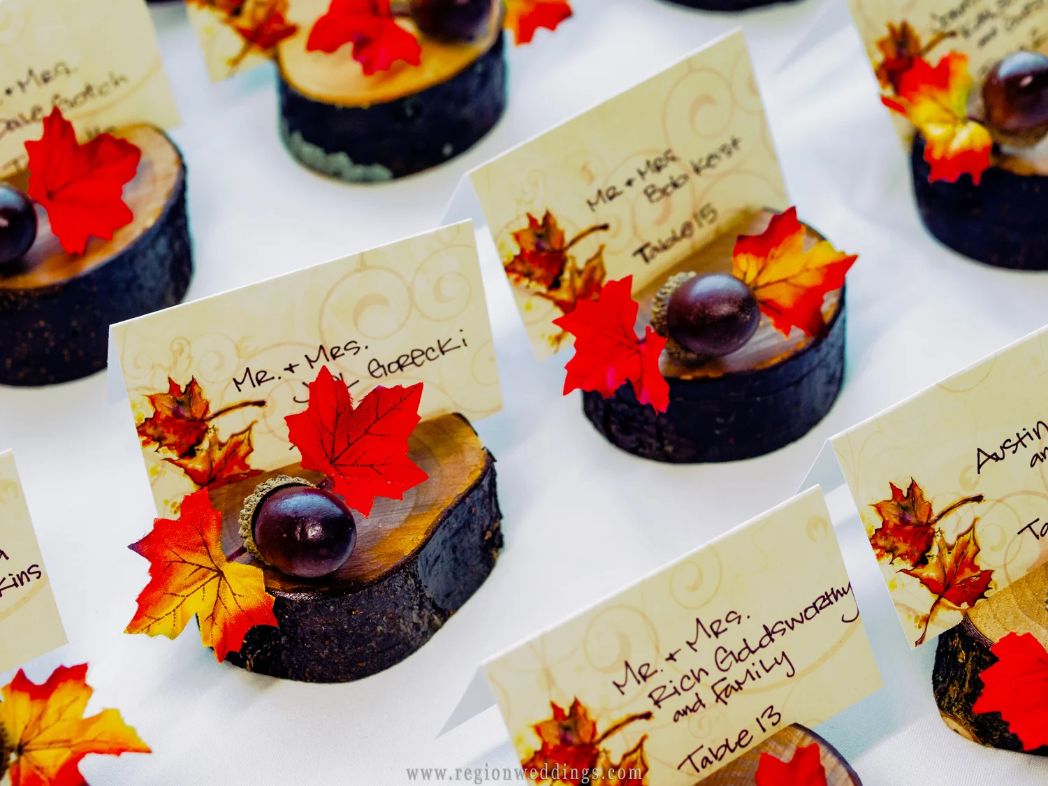 Carved out logs as wedding table placards.