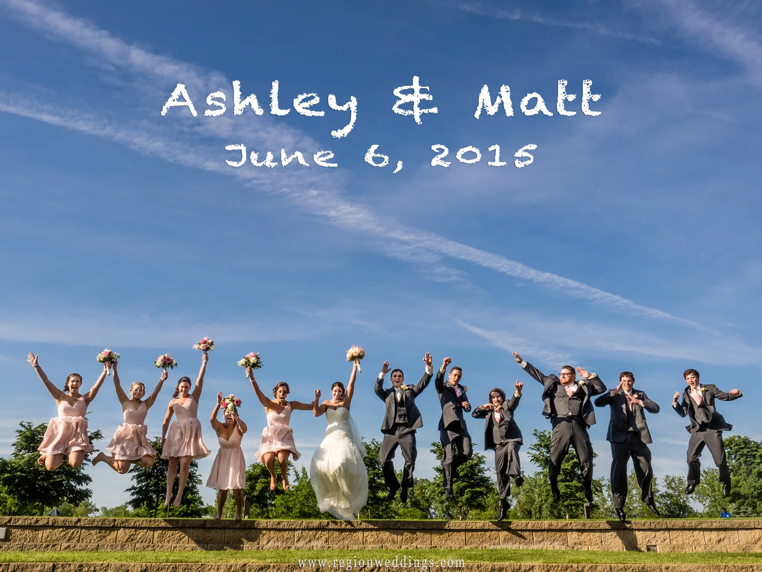 The wedding party jumps into the air in celebration.