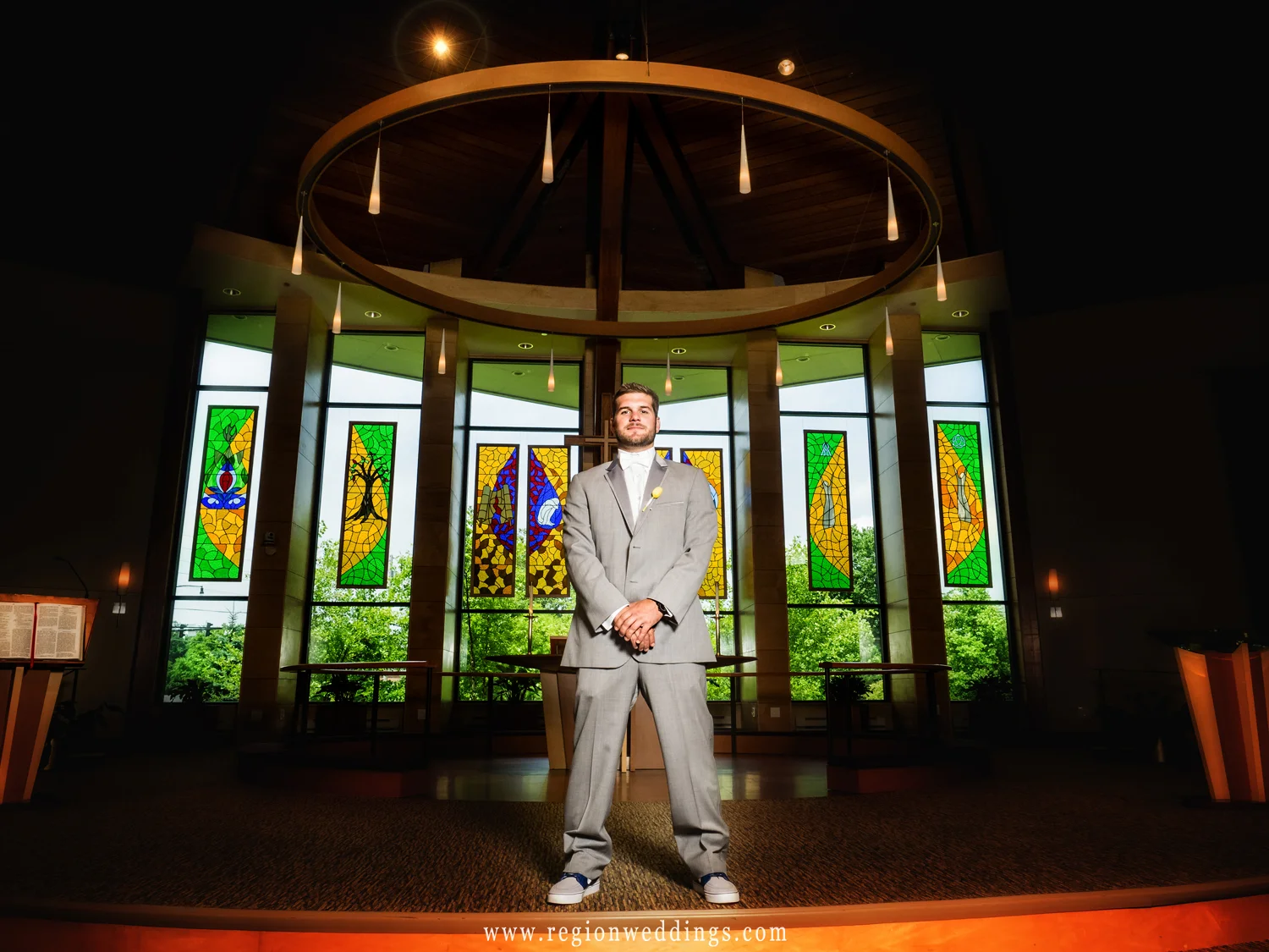 The groom stands tall at the altar of Christ Lutheran Church.