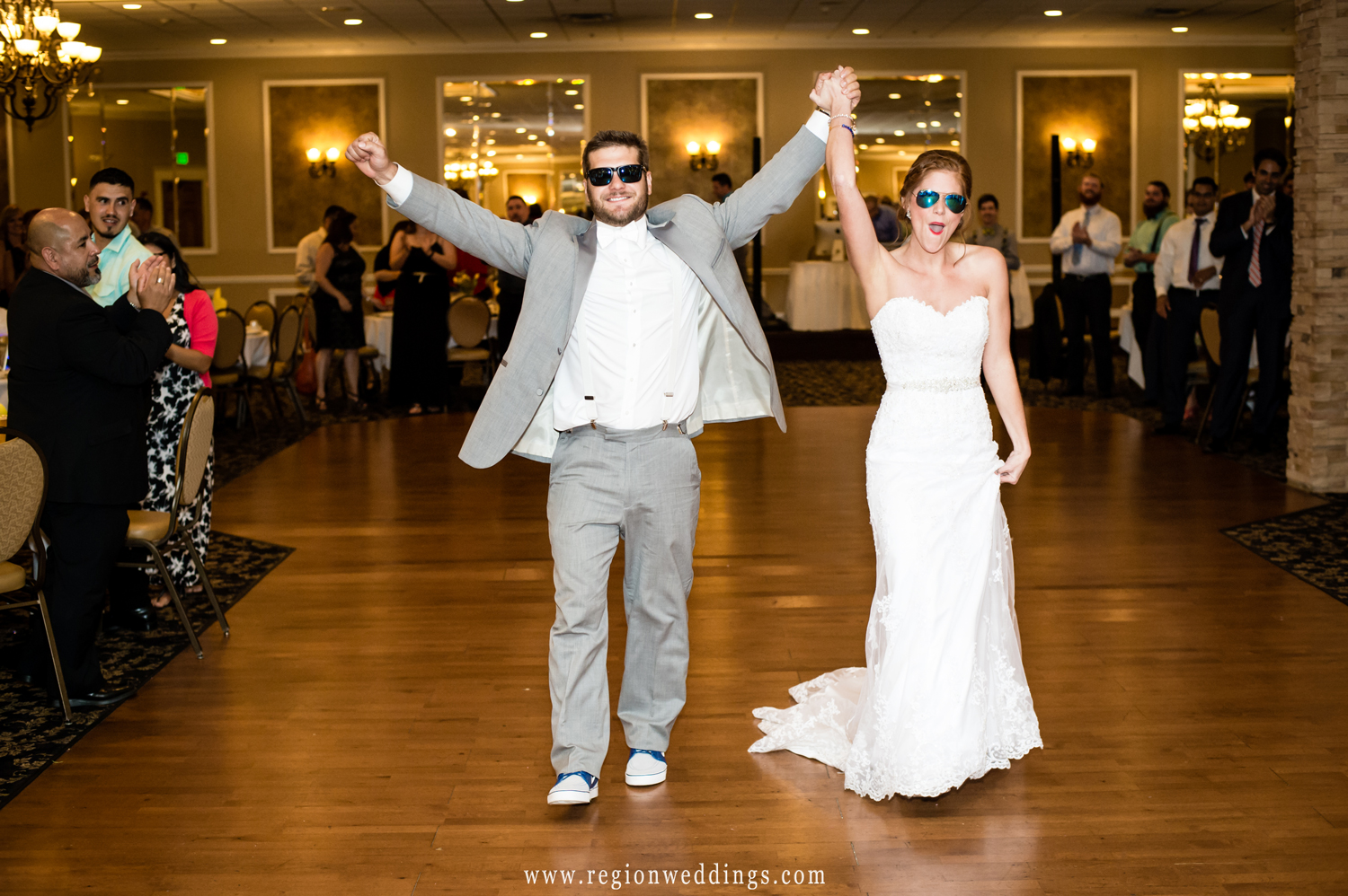 The newly married couple enter Ambassador Hall in Hobart, Indiana.