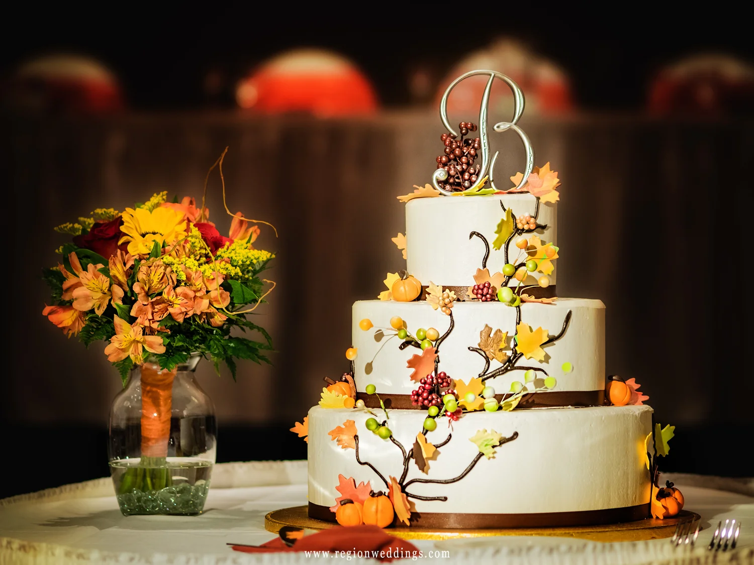Wedding cake decorated for the Fall season.