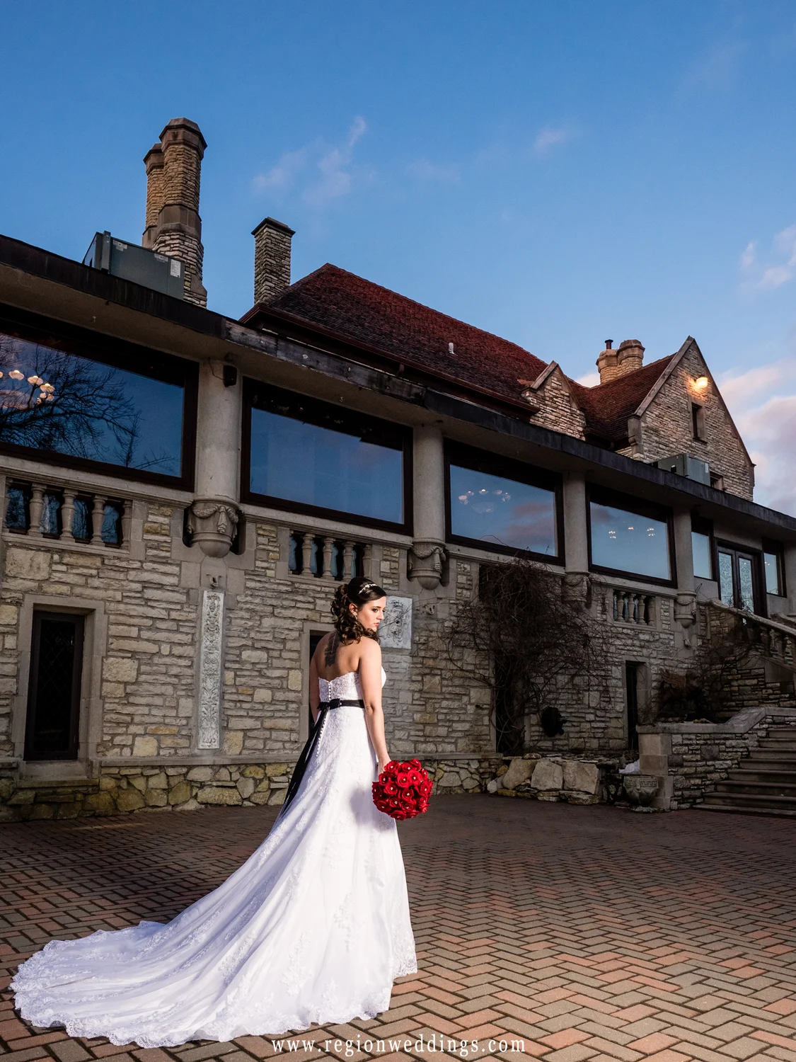 The bride shows off her dress on the patio terrace of Meyer's Castle.
