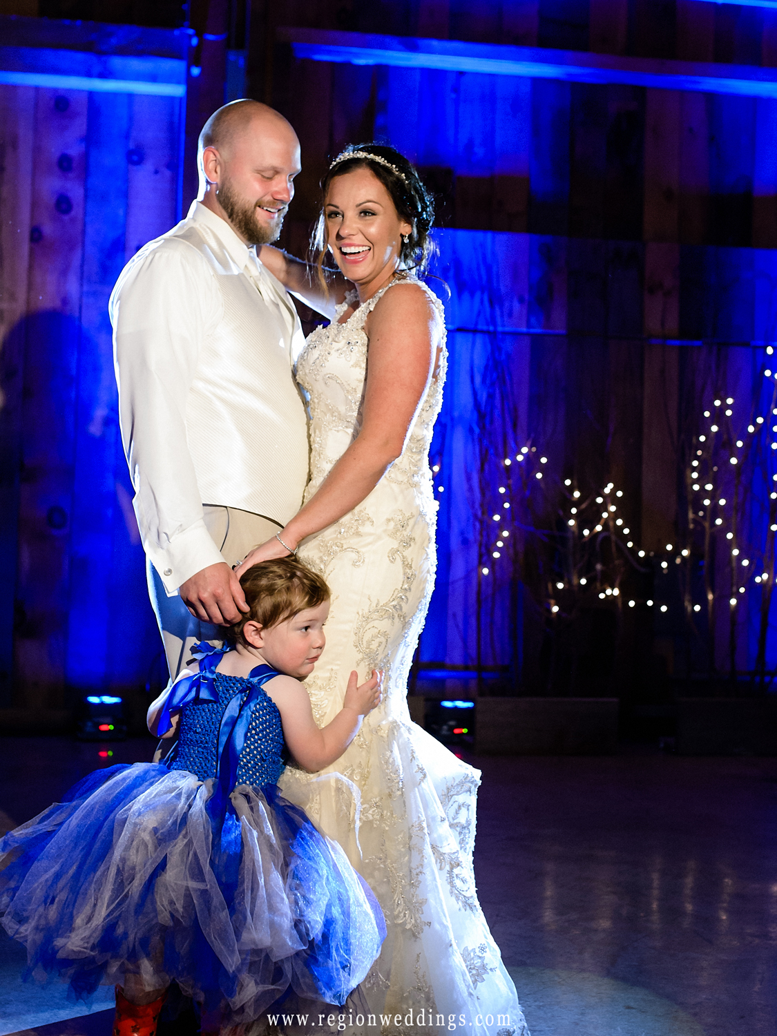 The flower girl charges onto the dance floor during the first dance at County Line Orchard.