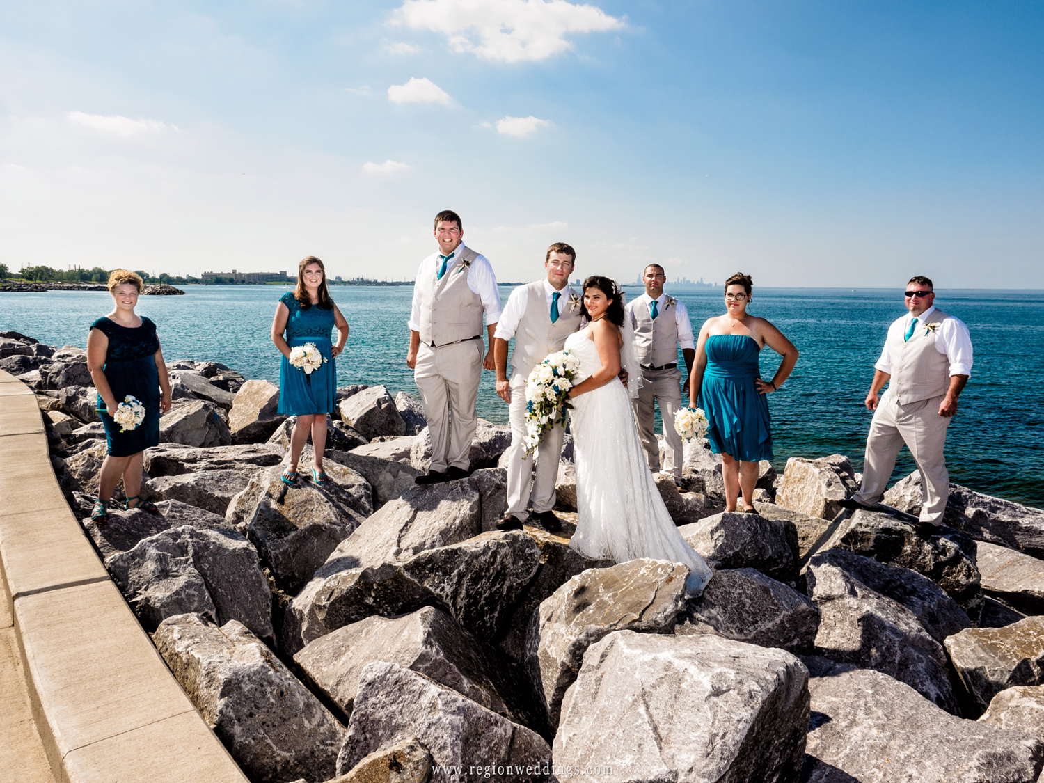 Wedding party on the shores of Lake Michigan with skyline of Chicago in the background.