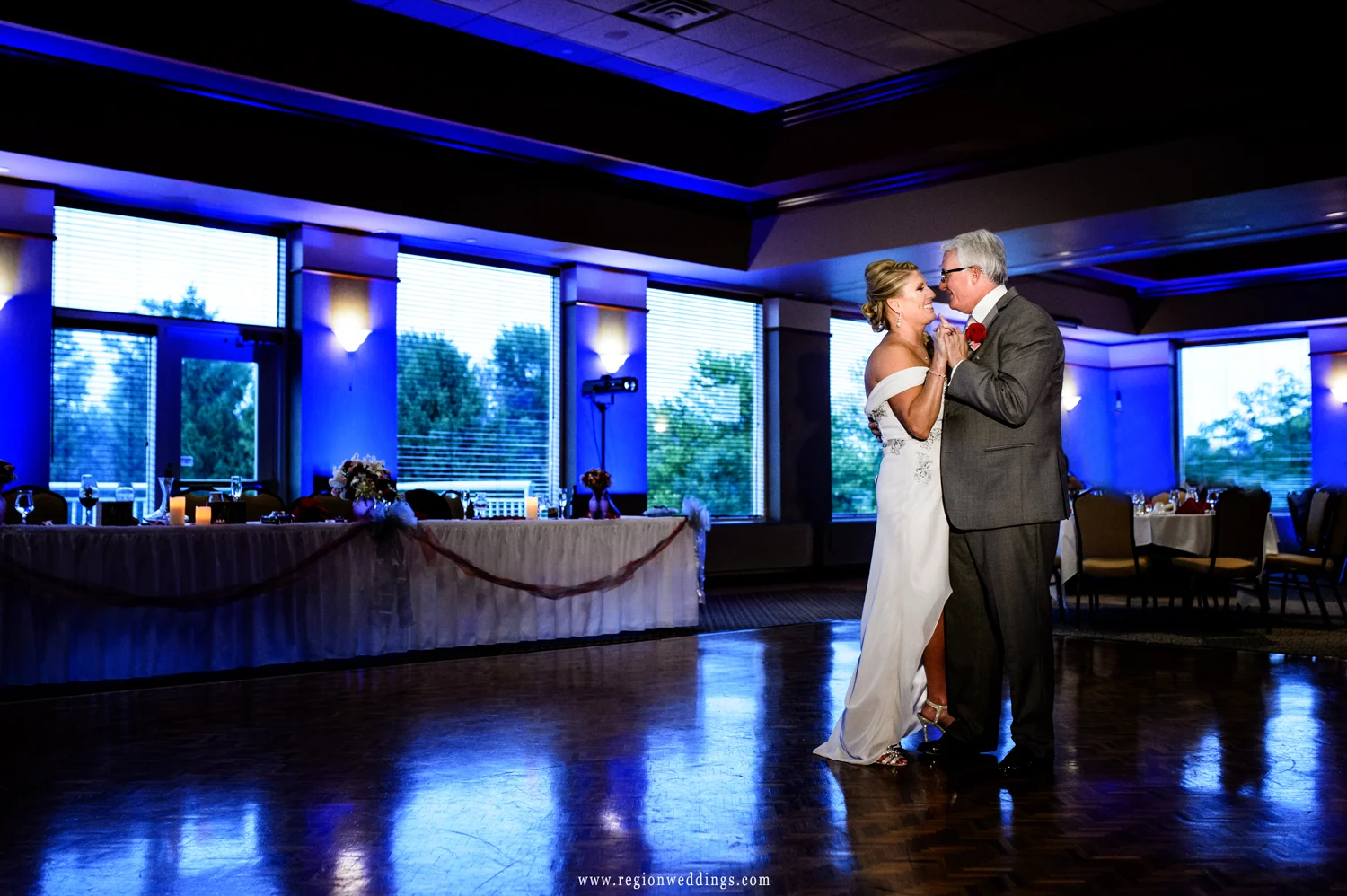 First dance for the bride and groom in the ballroom of Sand Creek Country Club.
