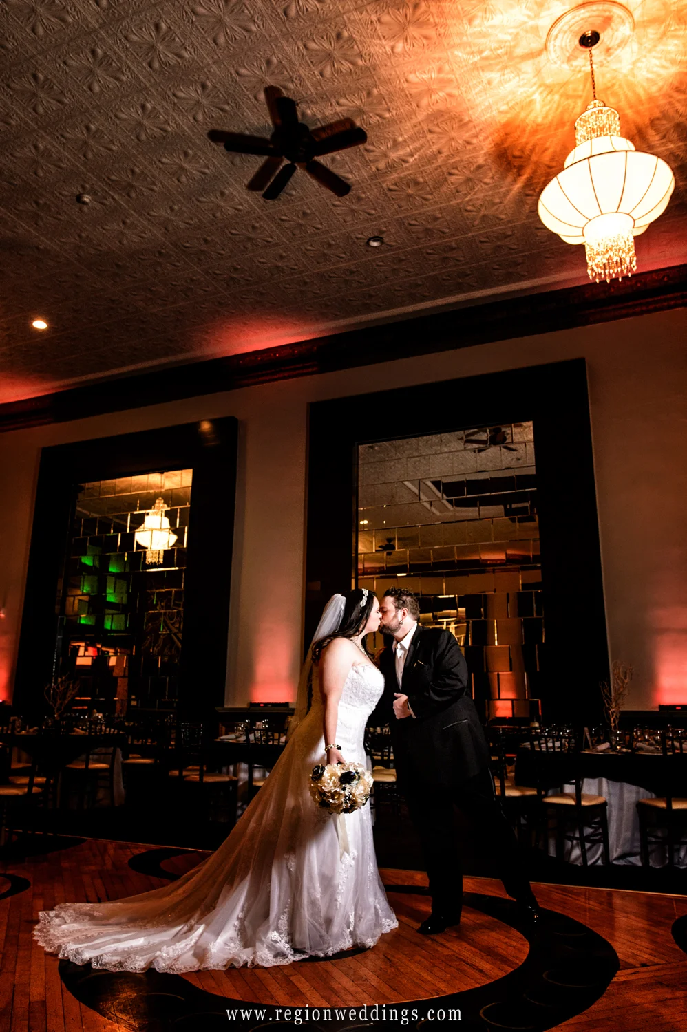 A kiss at the center of The Allure ballroom.