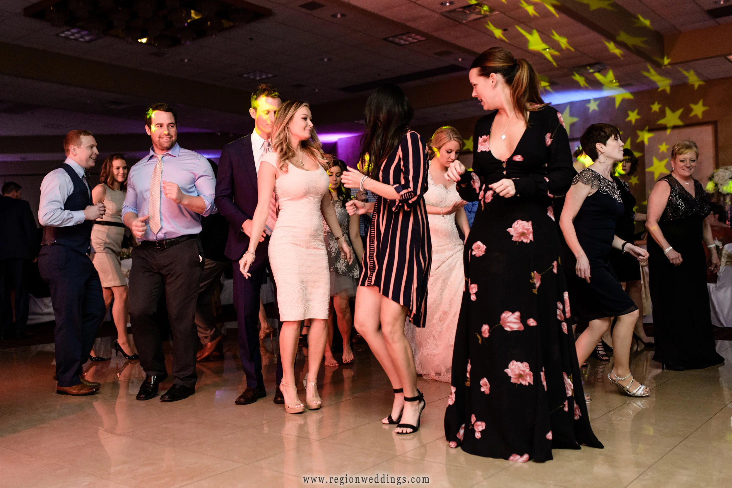 A full dance floor at Villa Cesare during a winter wedding reception.