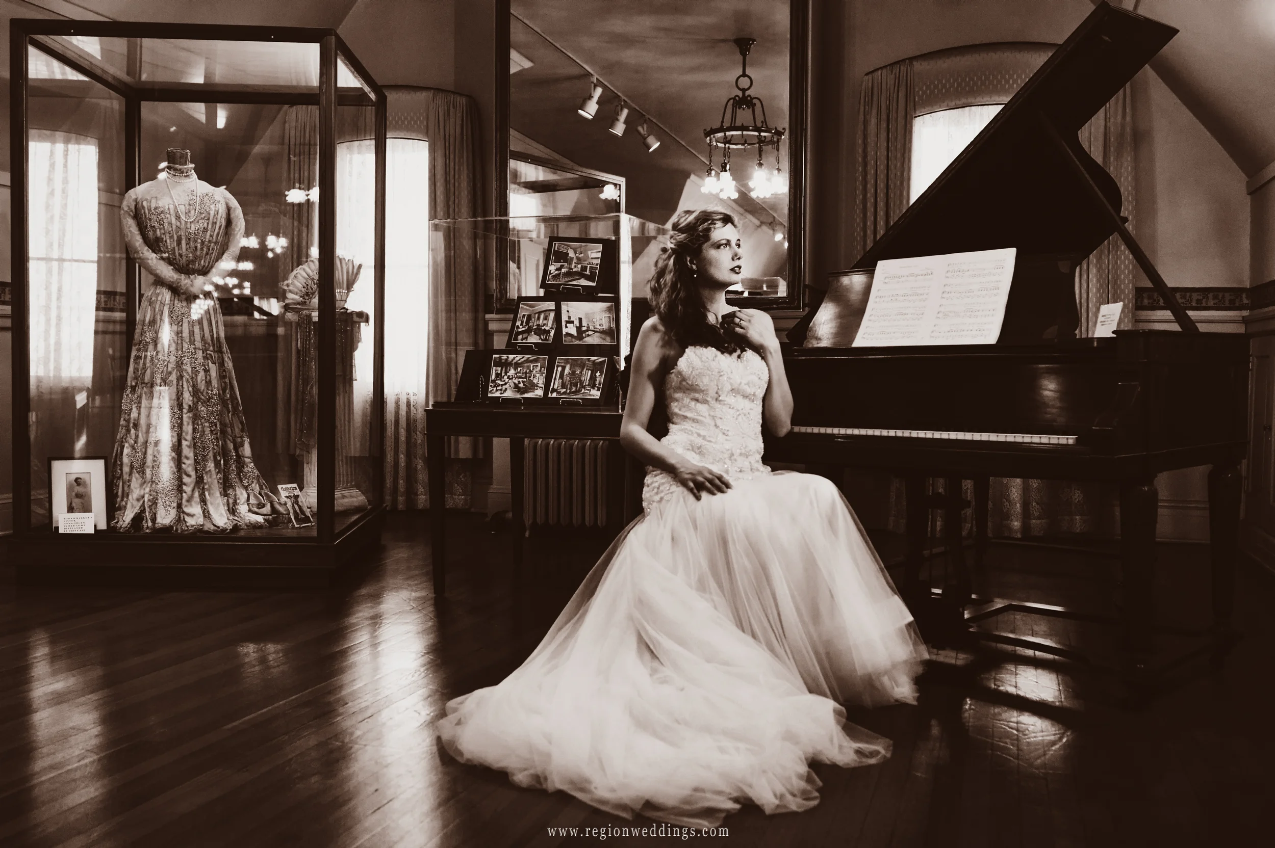 Bride at the piano in a vintage, sepia toned photograph.