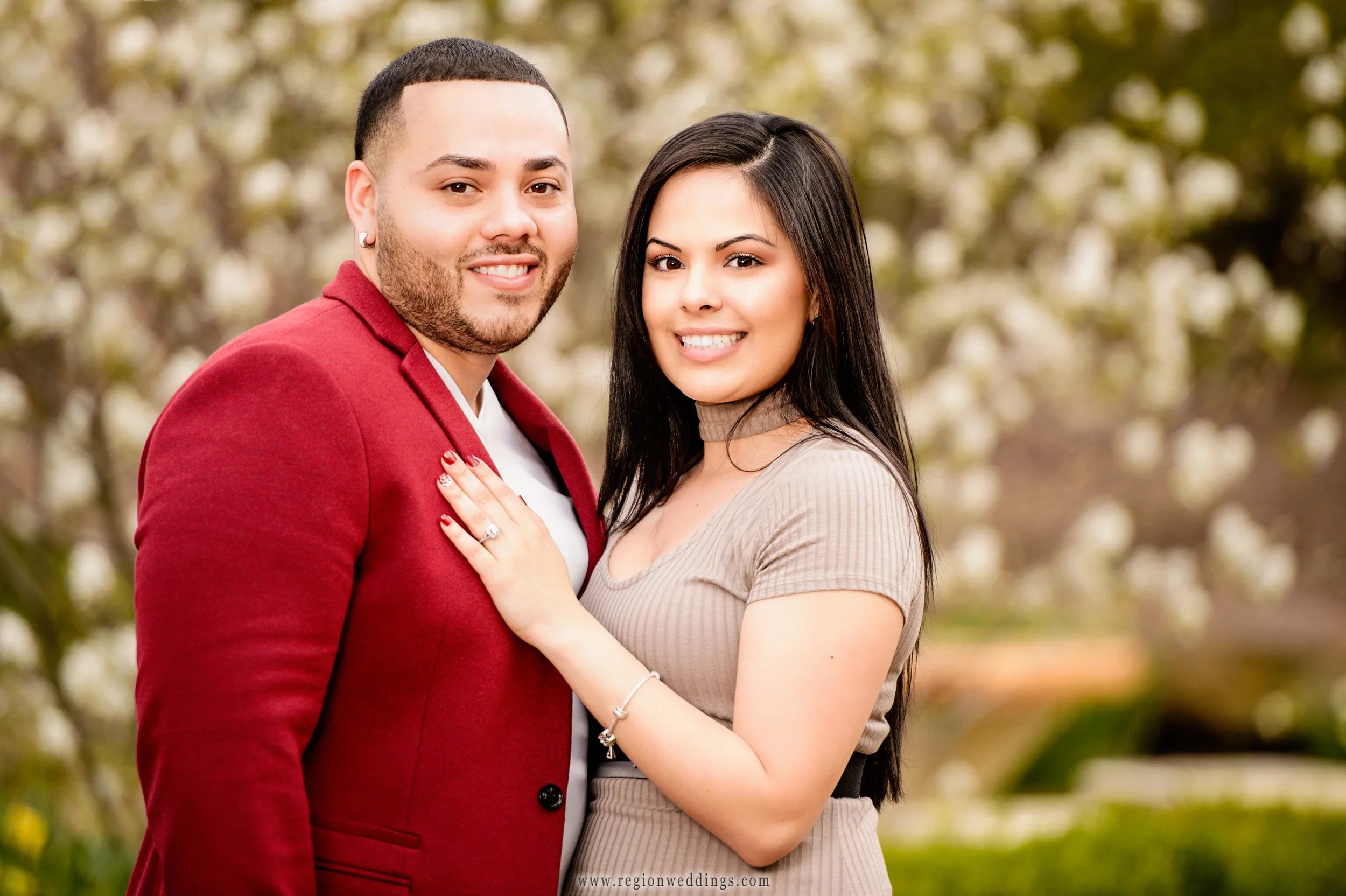 A portrait of a young couple for their engagement session at Ogden Garden park.