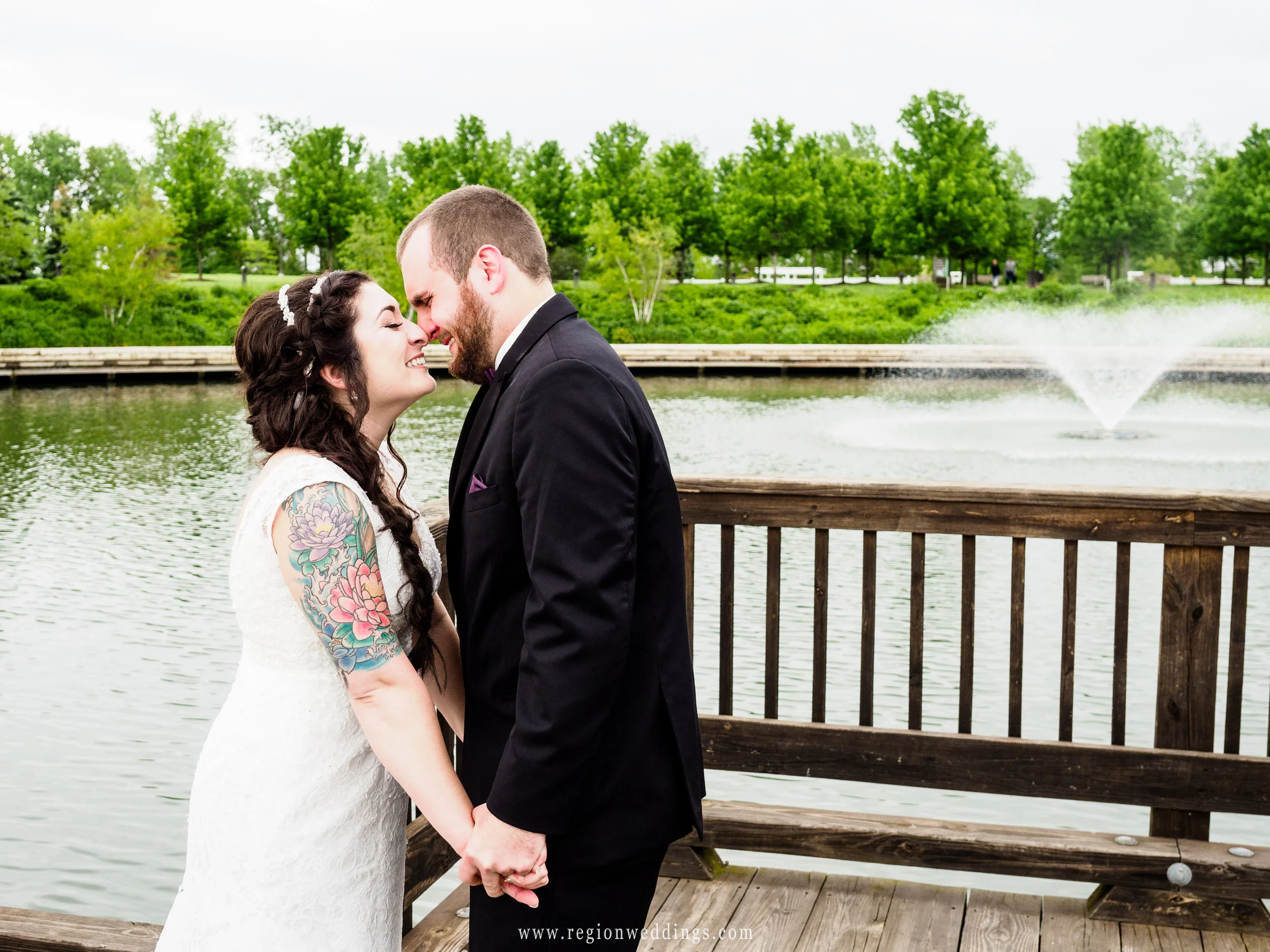 Bride and groom eskimo kiss during their first look.