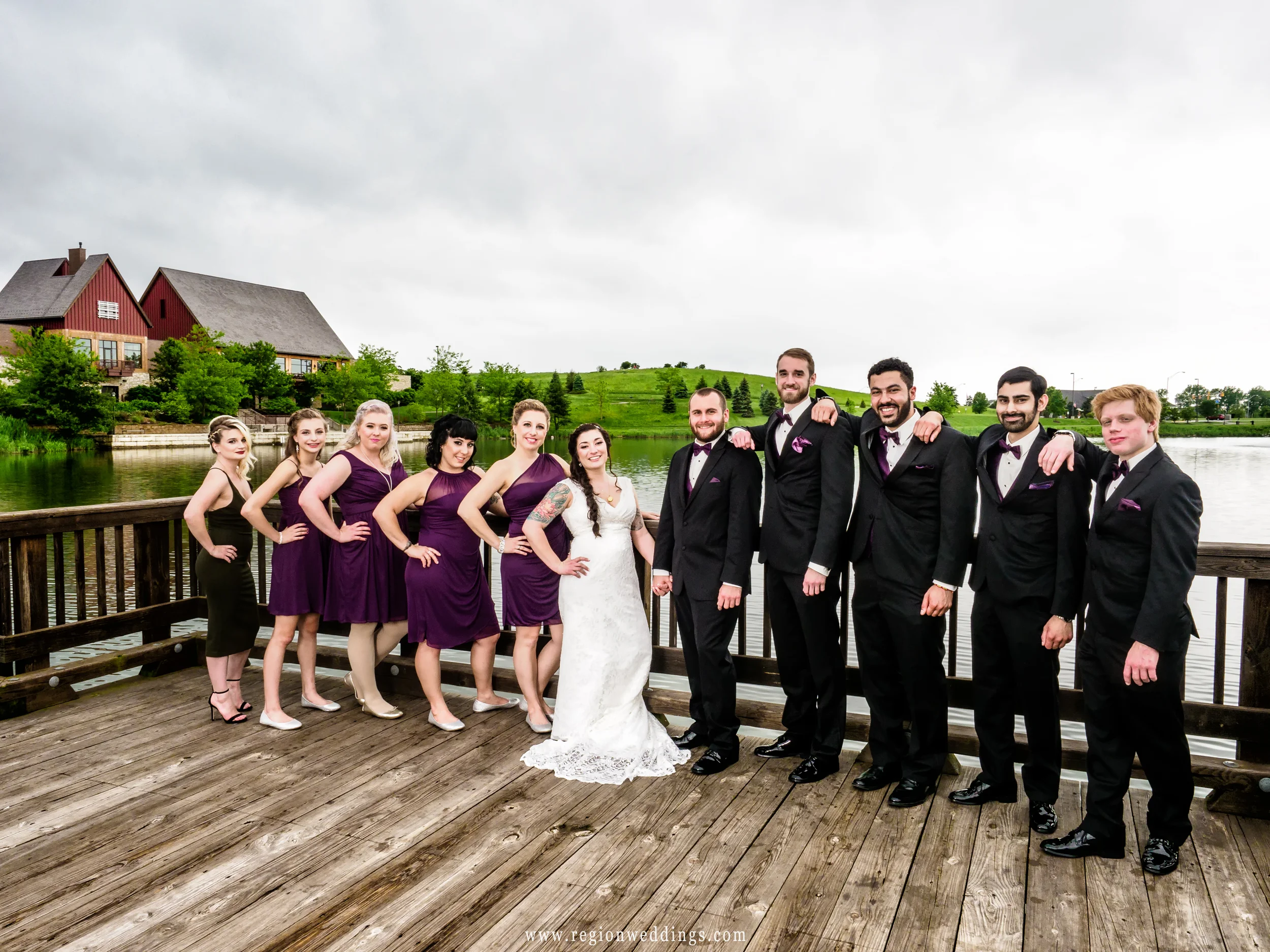 Wedding party photo on the lake bridge at Centennial Park.