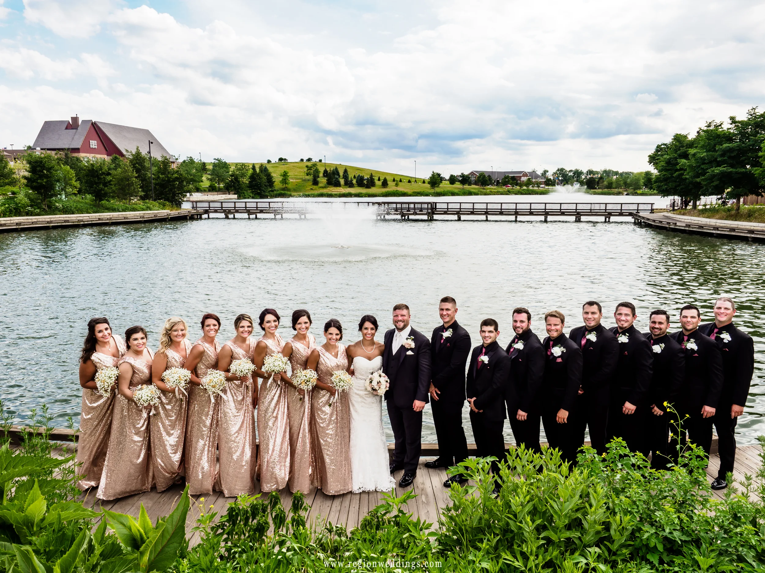 Wedding party group photos overlooking the lake fountain at Centennial Park.