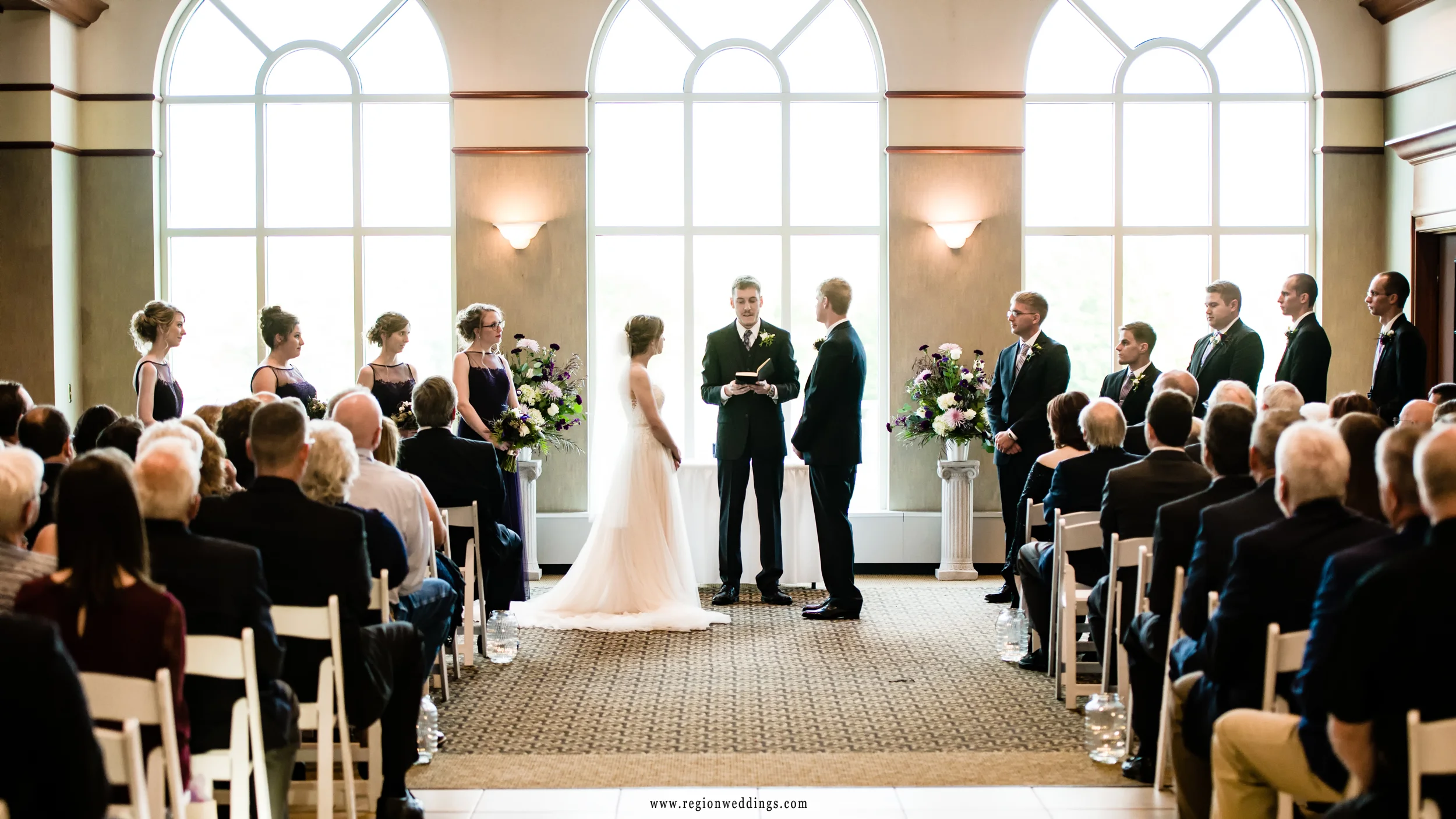 Light streams in behind the bride and groom at Sand Creek in Chesterton, Indiana.