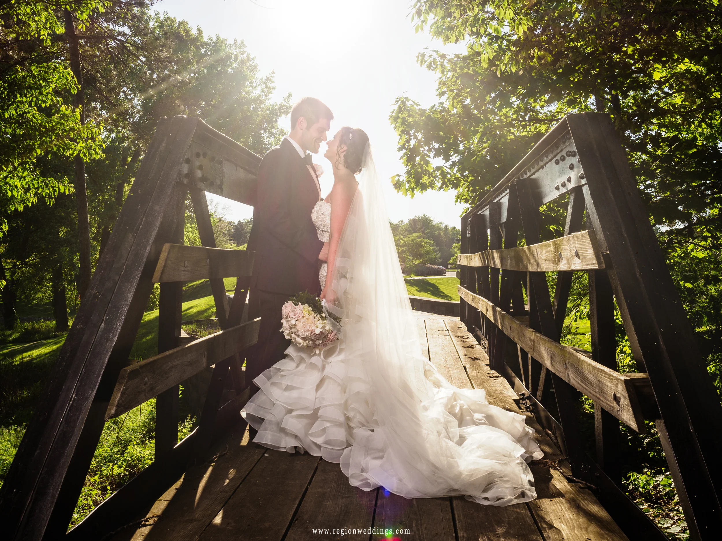 Bride and groom on the kissing bridge at Valparaiso University.
