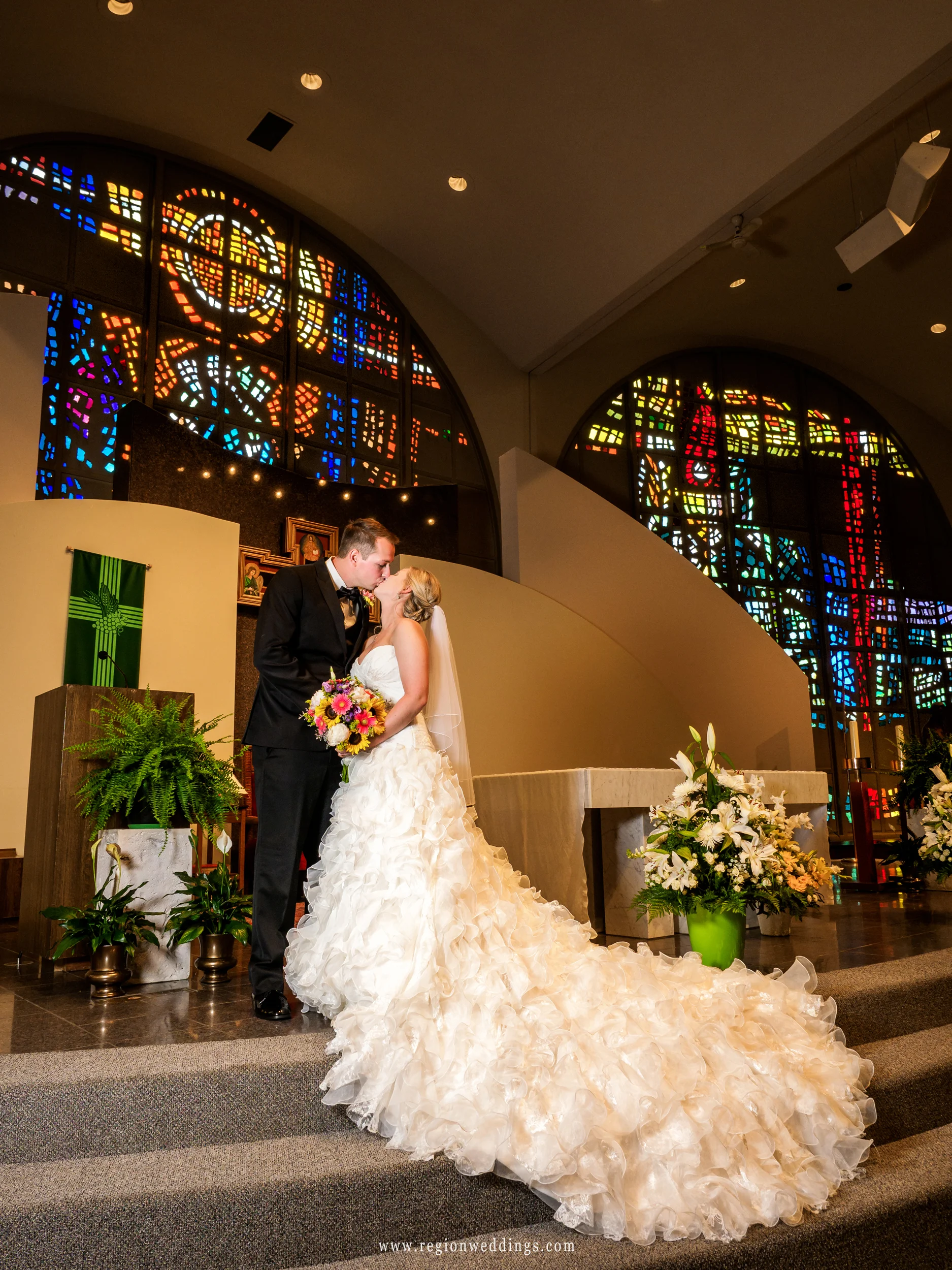 Bride and groom on the altar of St. Paul.