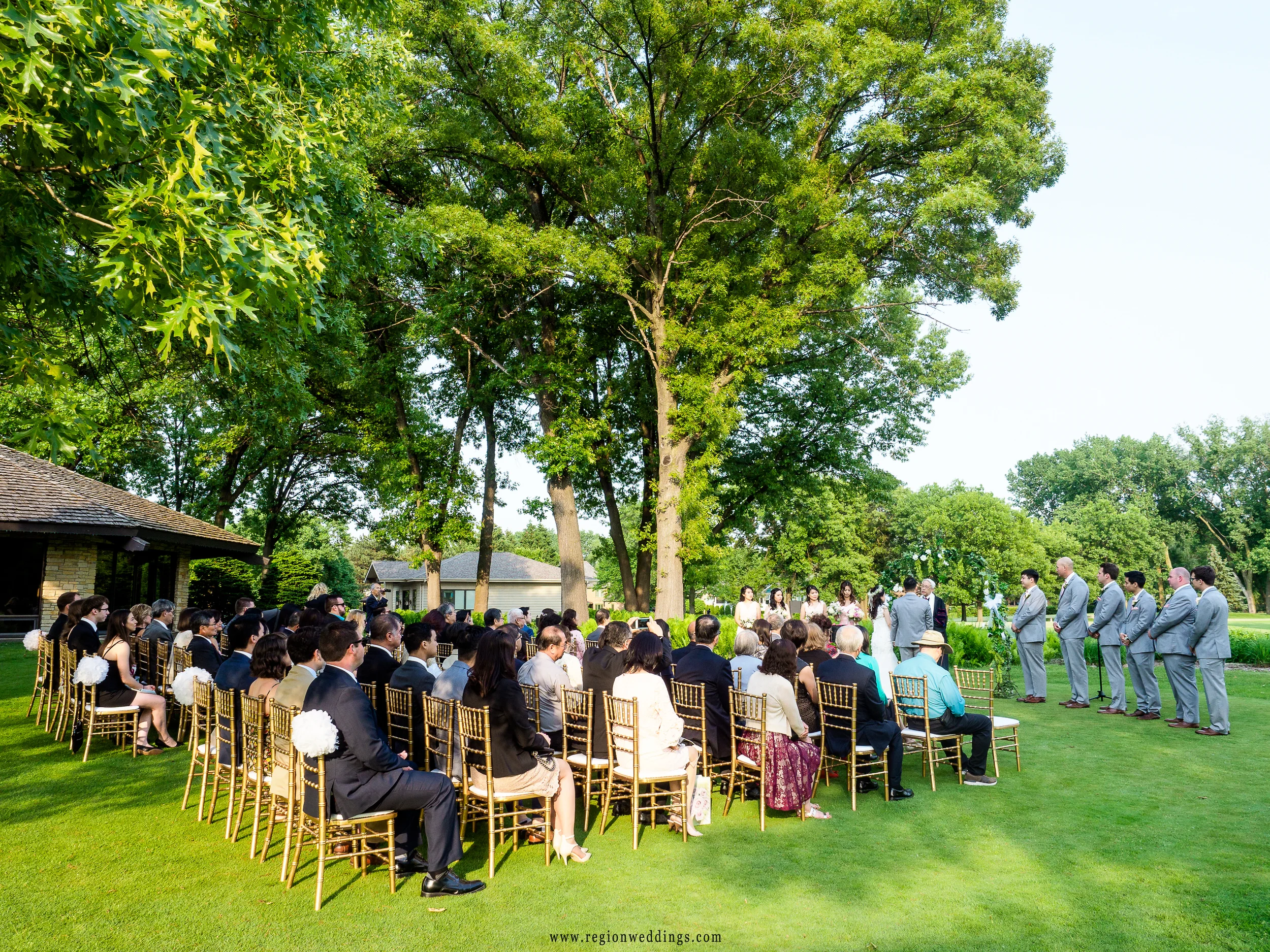 Outdoor summer wedding on the golf course.