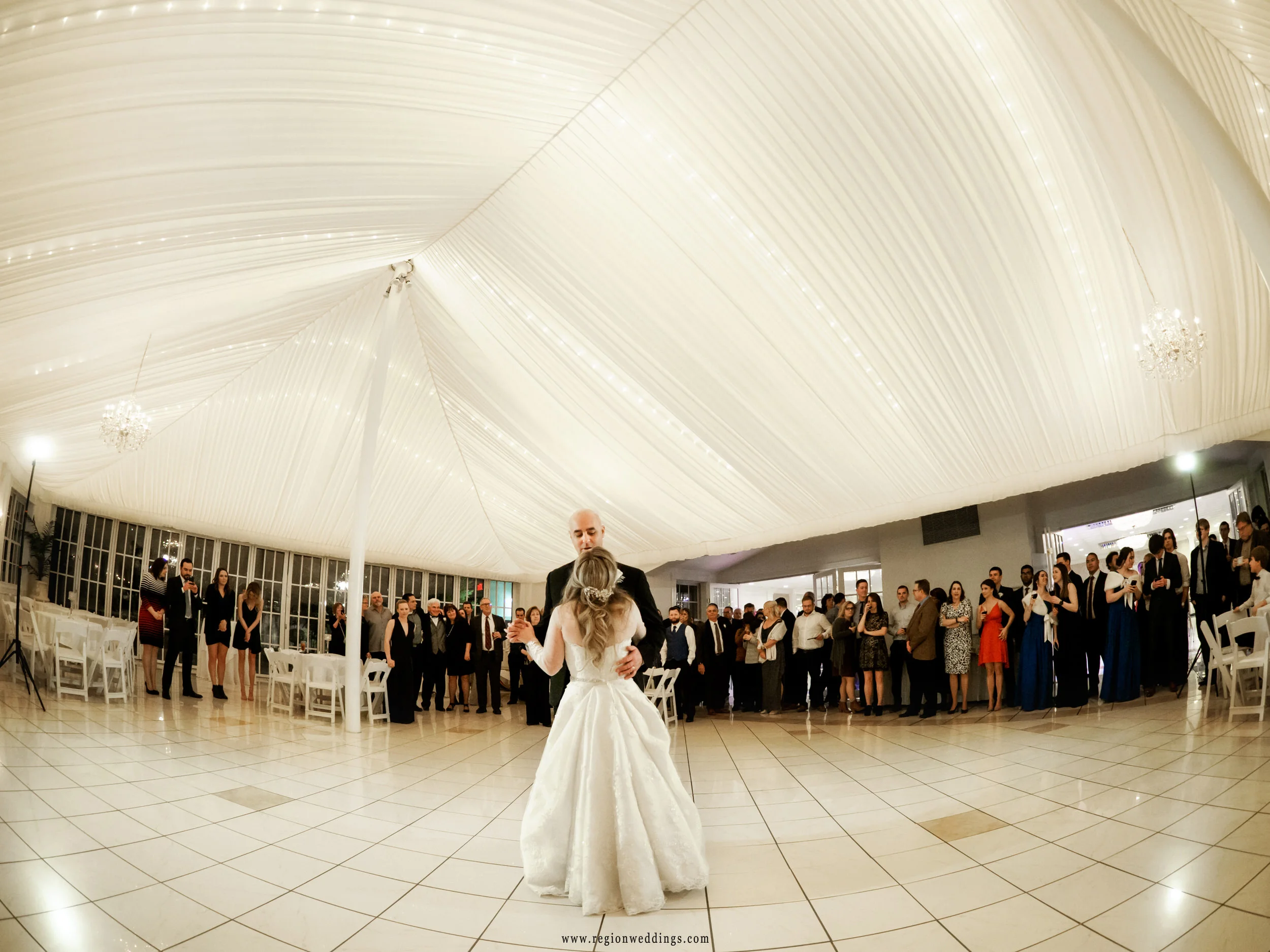 First dance for the newlyweds as friends and family surround them on the dance floor at Chateau Bu-Sché.