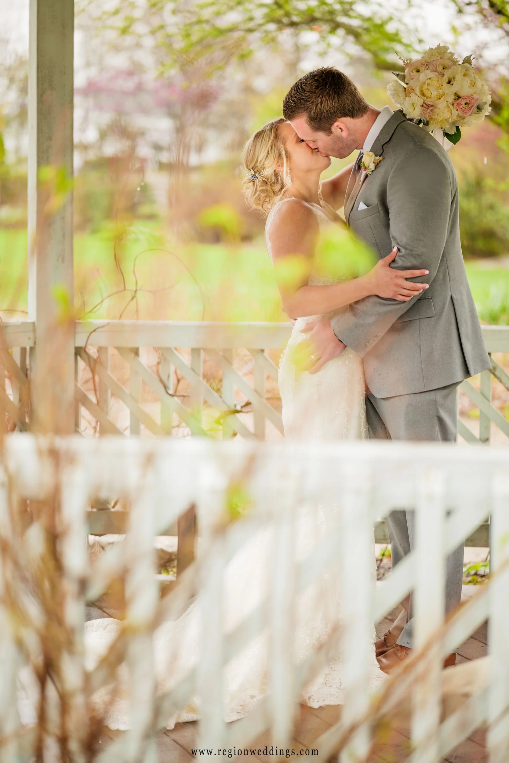 Kissing underneath the gazebo at Ogden Garden.
