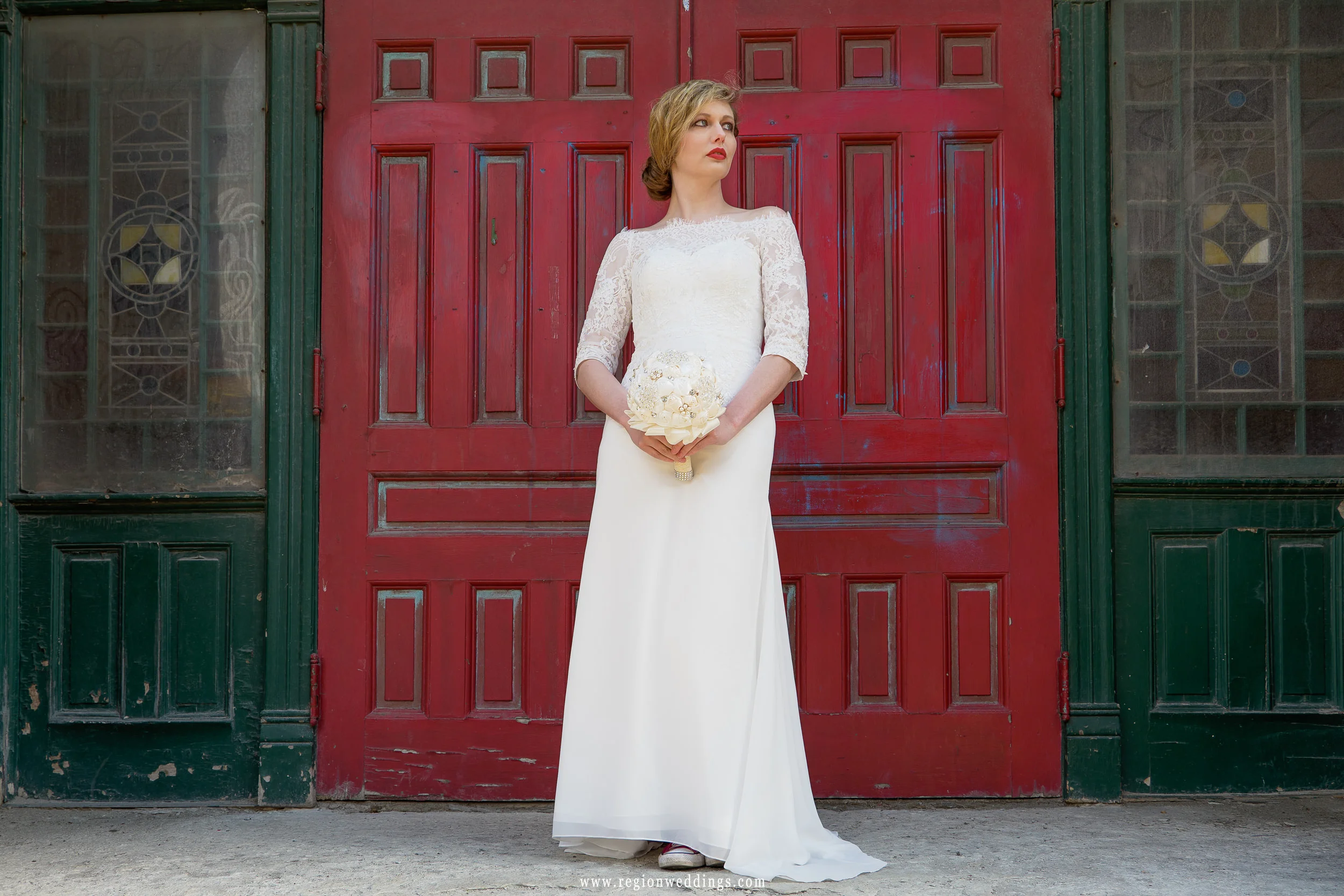 Bridal portrait in front of a grungy red door in Chicago.