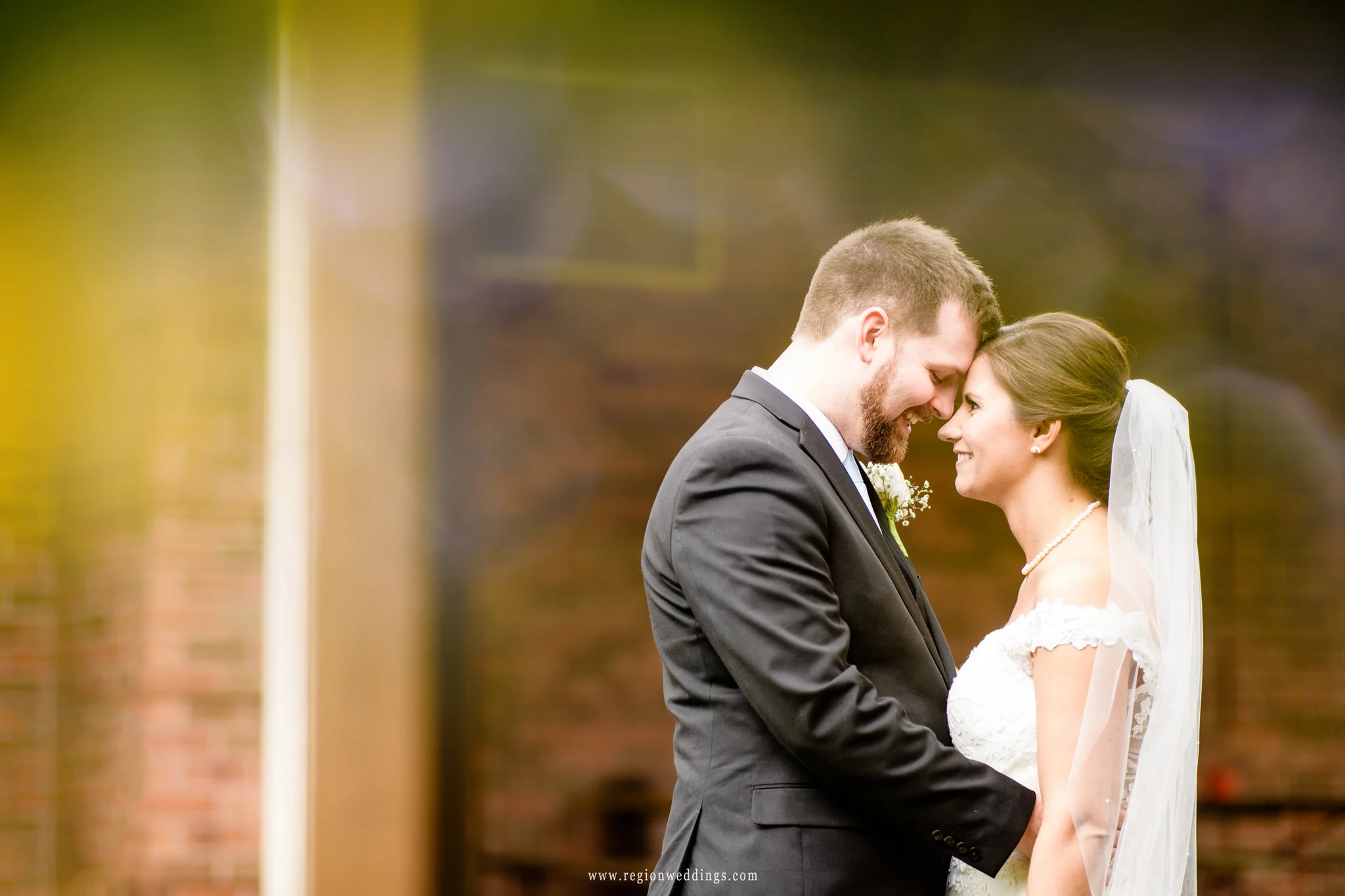 Bride and groom share a moment outside the gazebo at Villa Cesare.