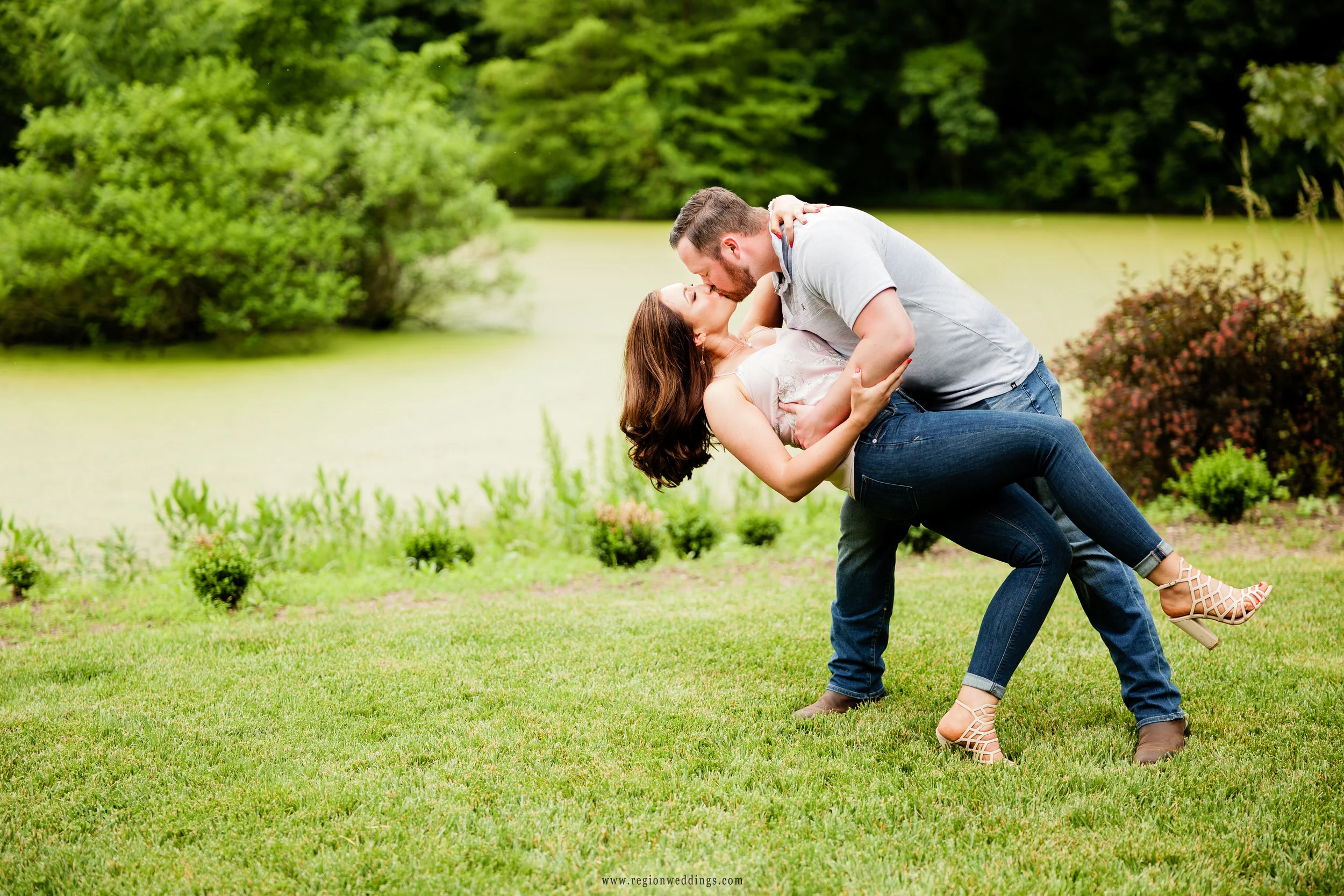 A kiss and dip in front of the lake at Gabis Arboretum.