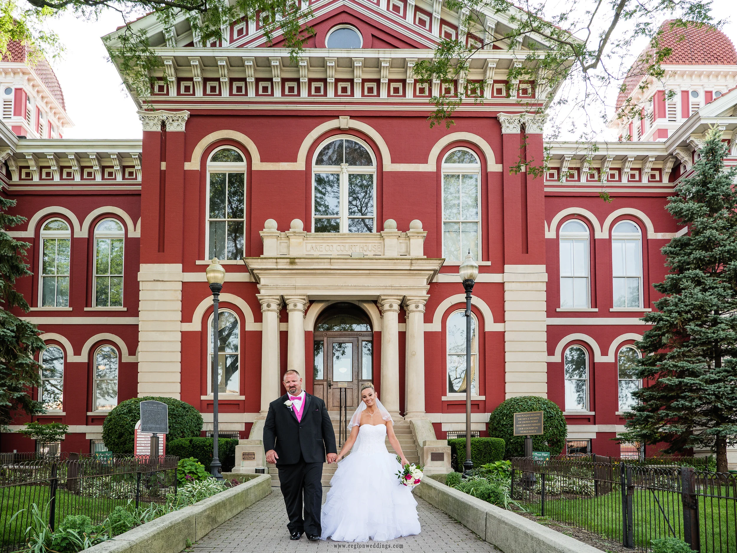 Bride and groom at the entrance of the historic Lake County Courthouse.