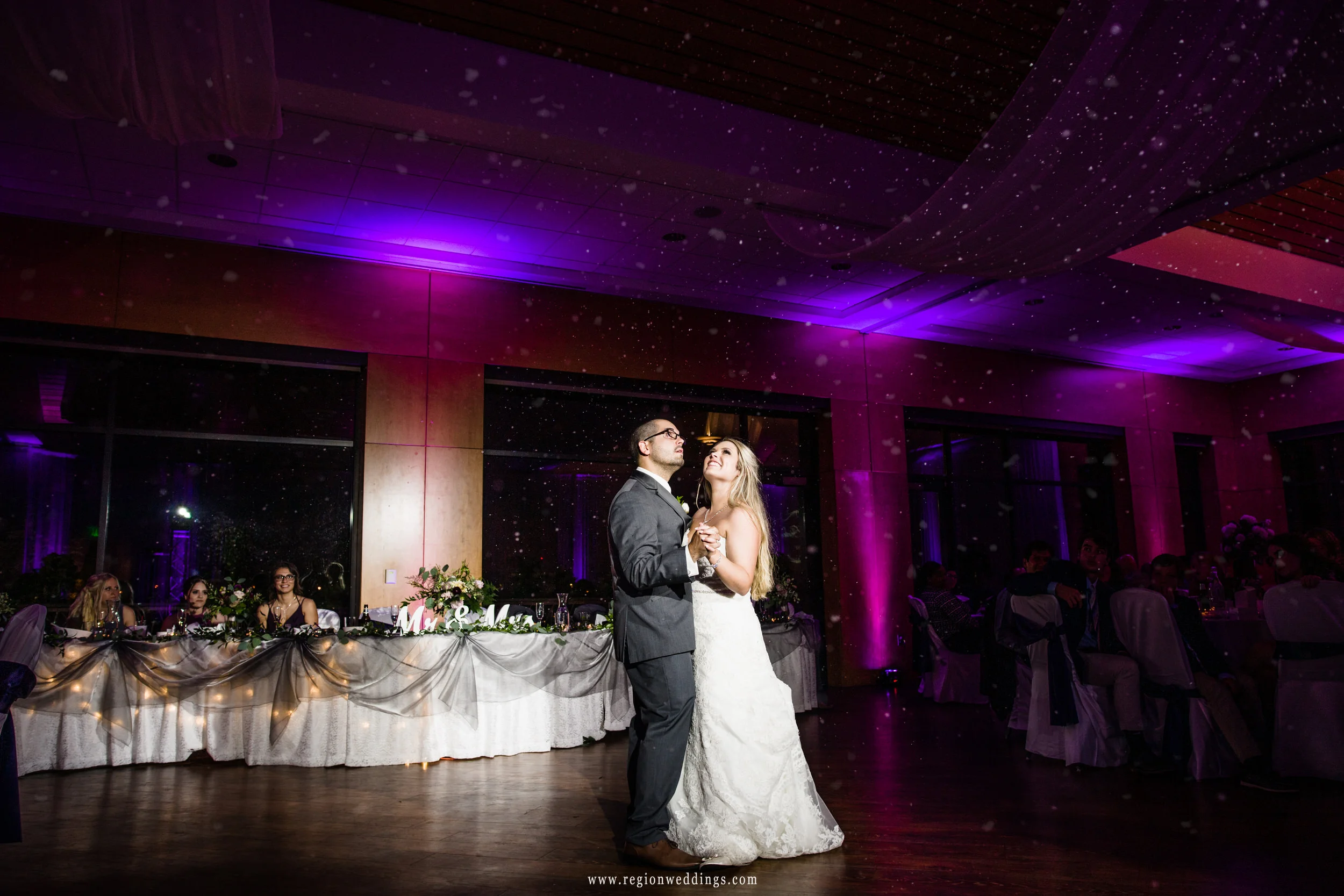 Snow descends upon the dance floor at a Centennial Park clubhouse wedding reception.