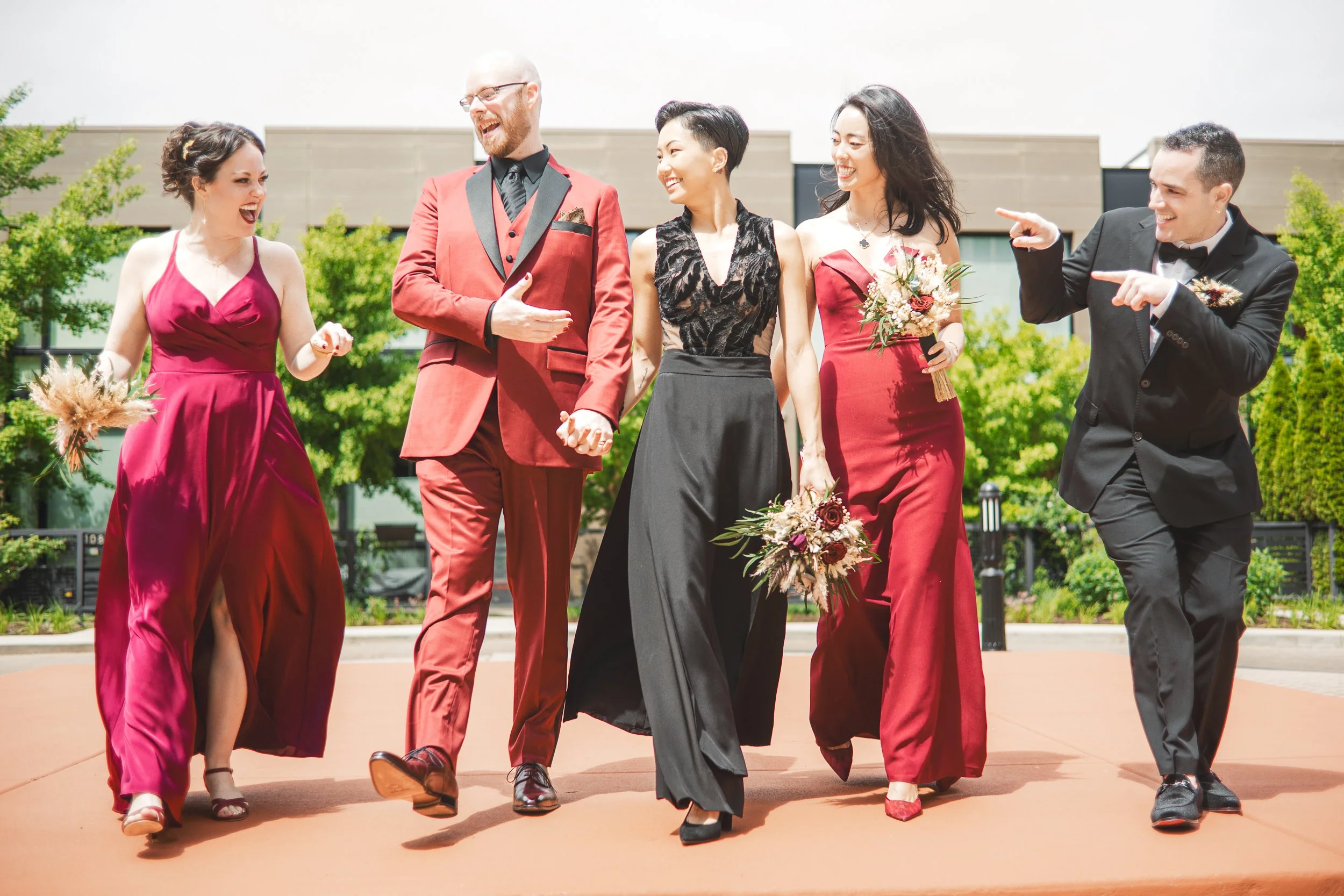 A wedding party walks together in the courtyard of The Guest House Hotel in Chicago, Illinois.