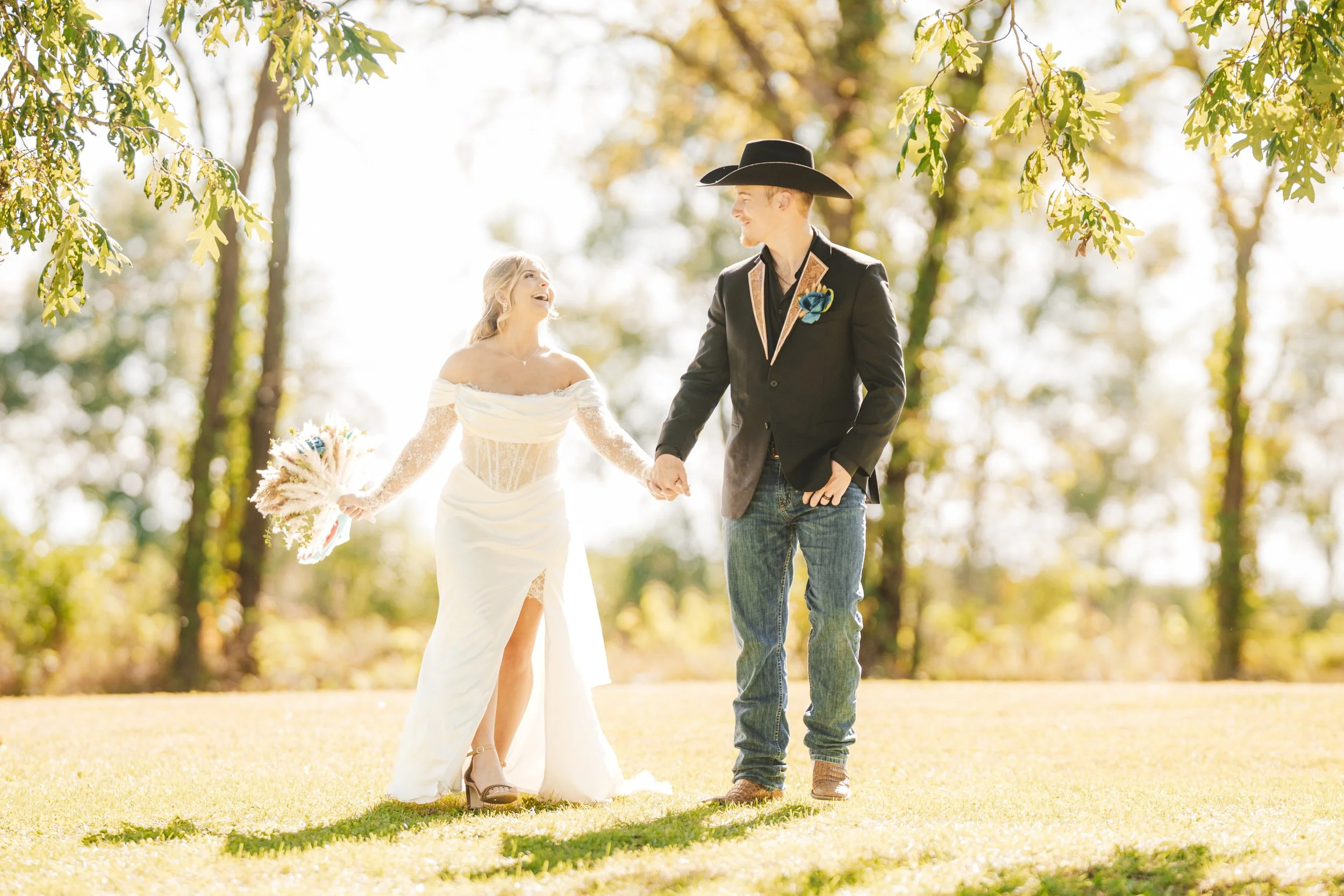 A newly married bride and groom take a stroll on an Indiana farm on their wedding day.