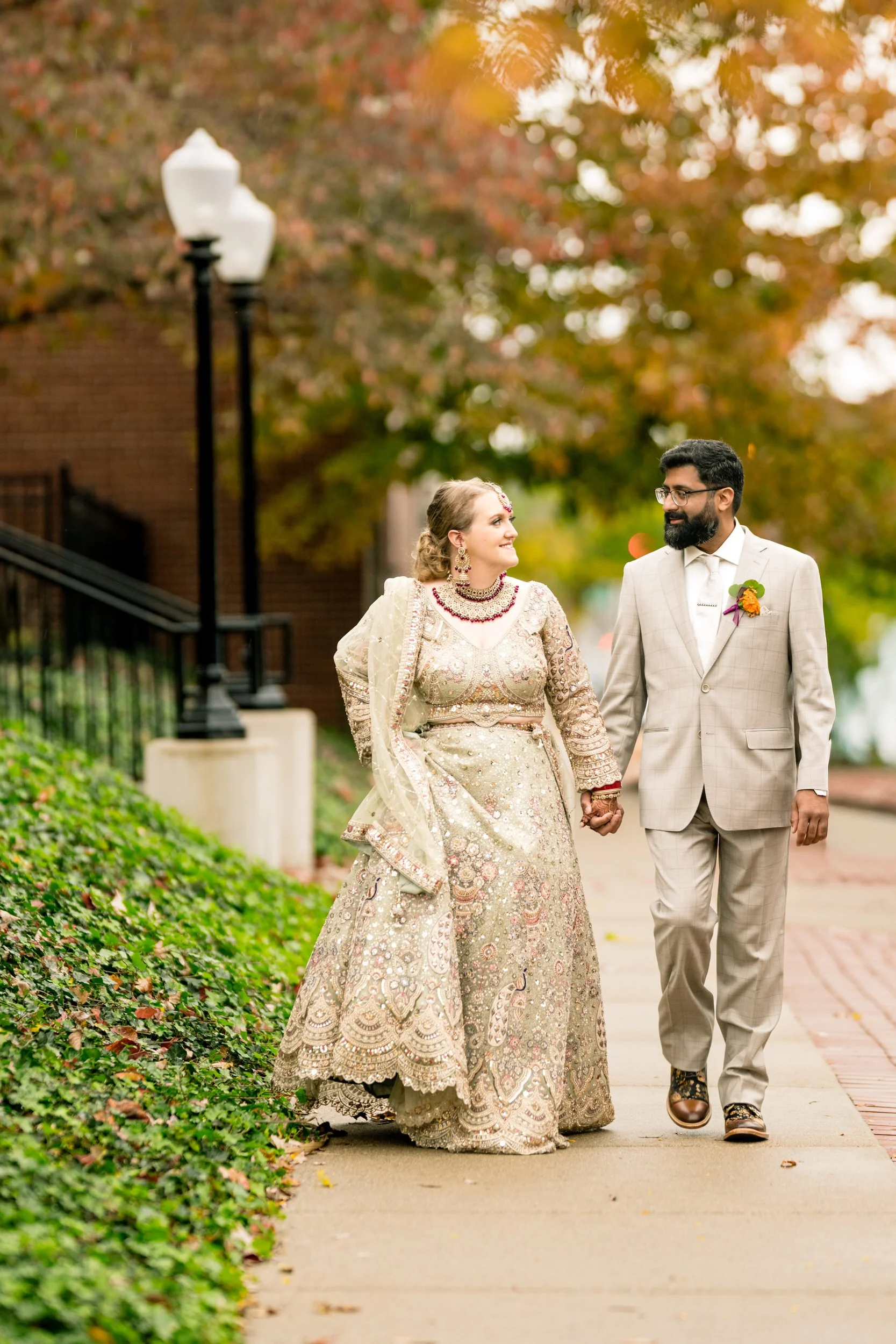 An Indian bride and groom take a stroll outside Duncan Hall in Lafayette, Indiana.